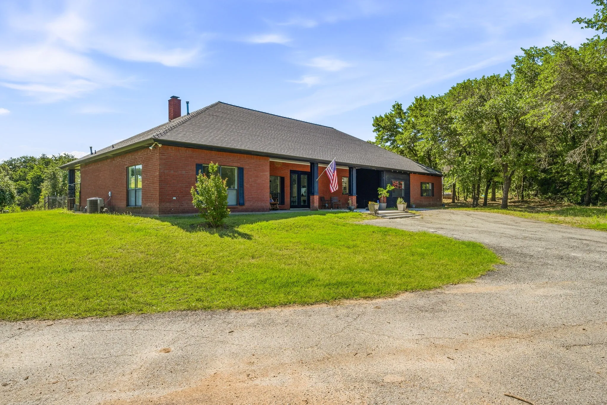 Brick exterior with dark gray roofing