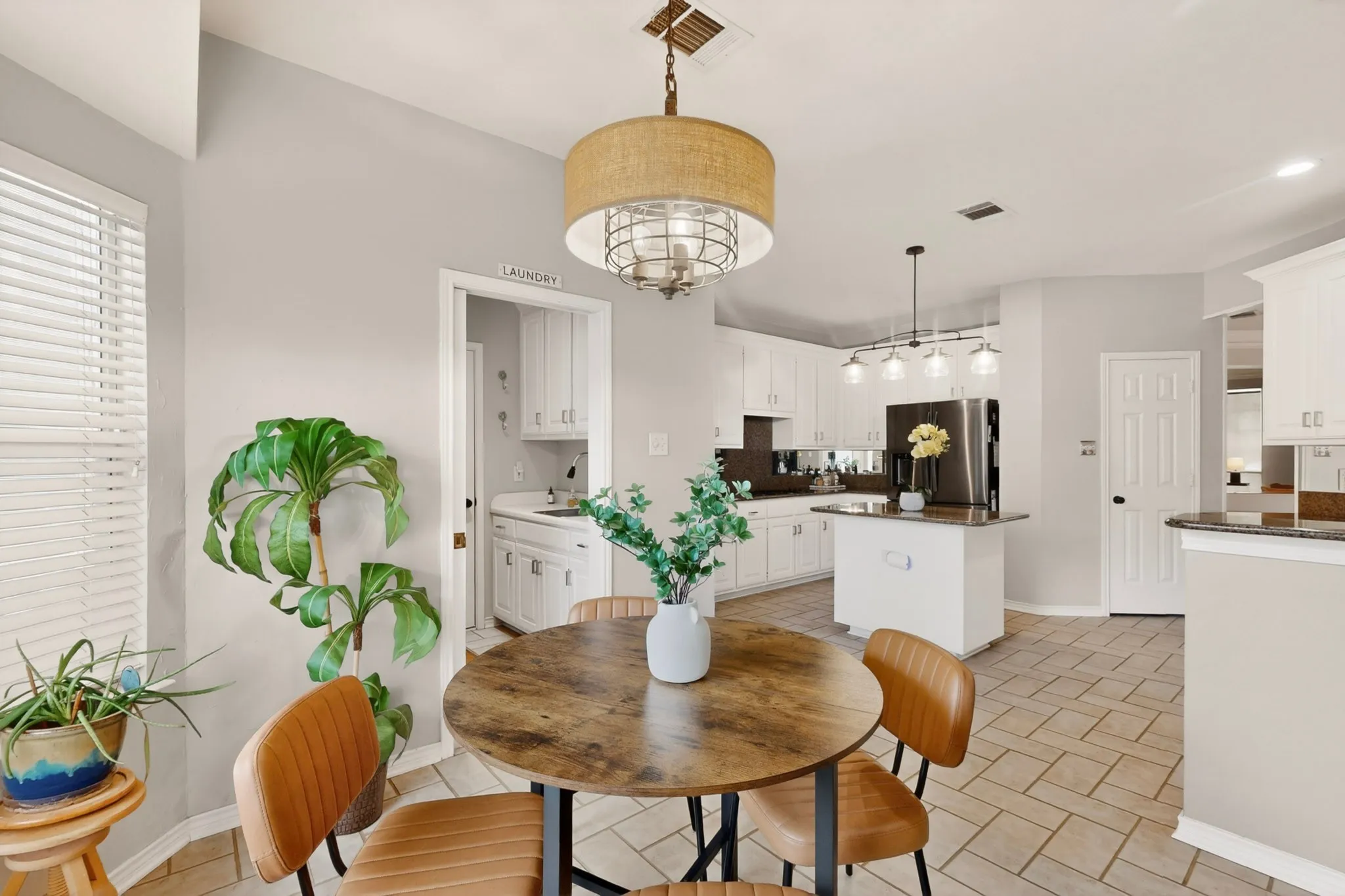 Open concept kitchen and dining area featuring ceramic tile flooring