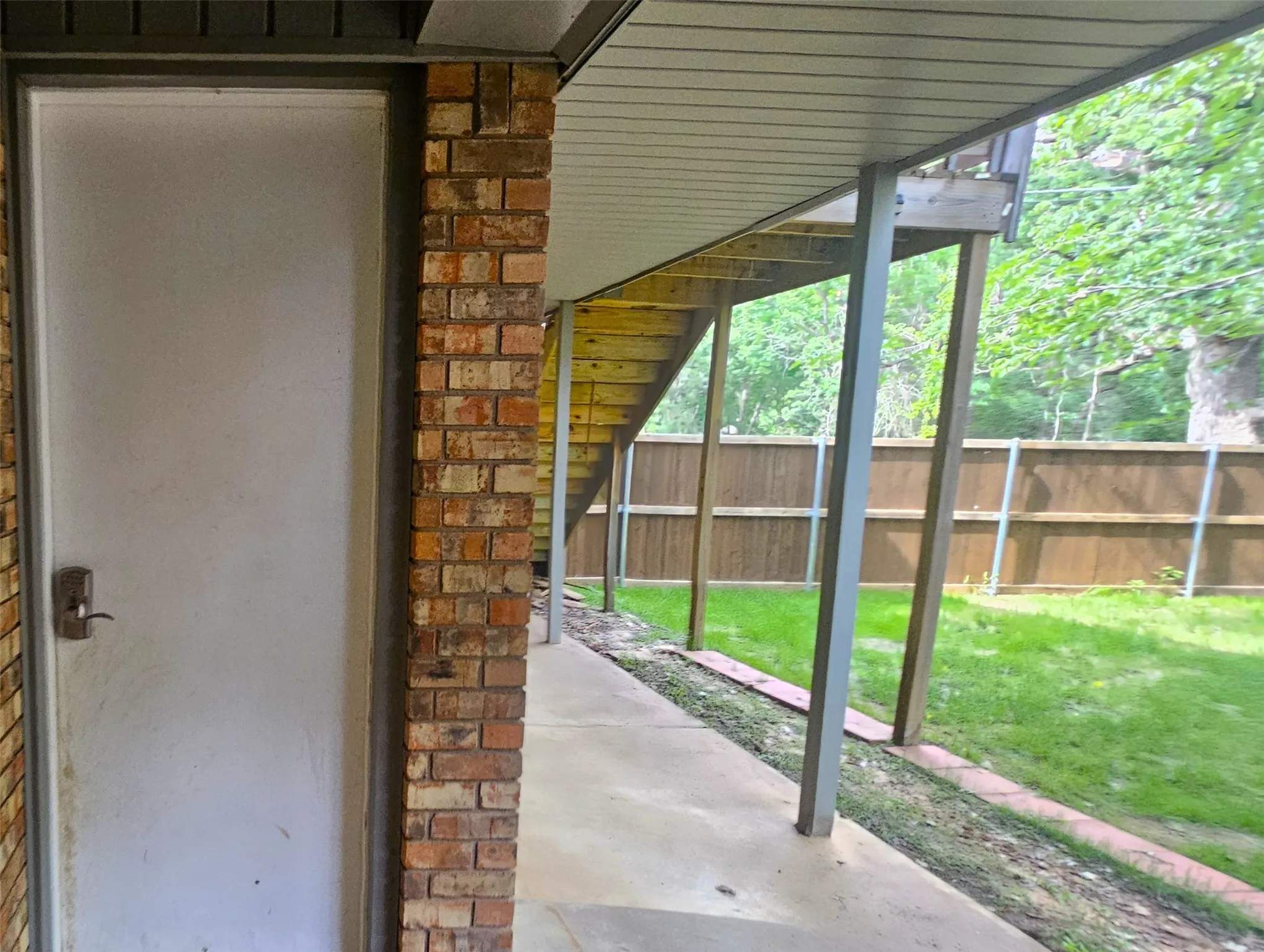View of patio access to garage