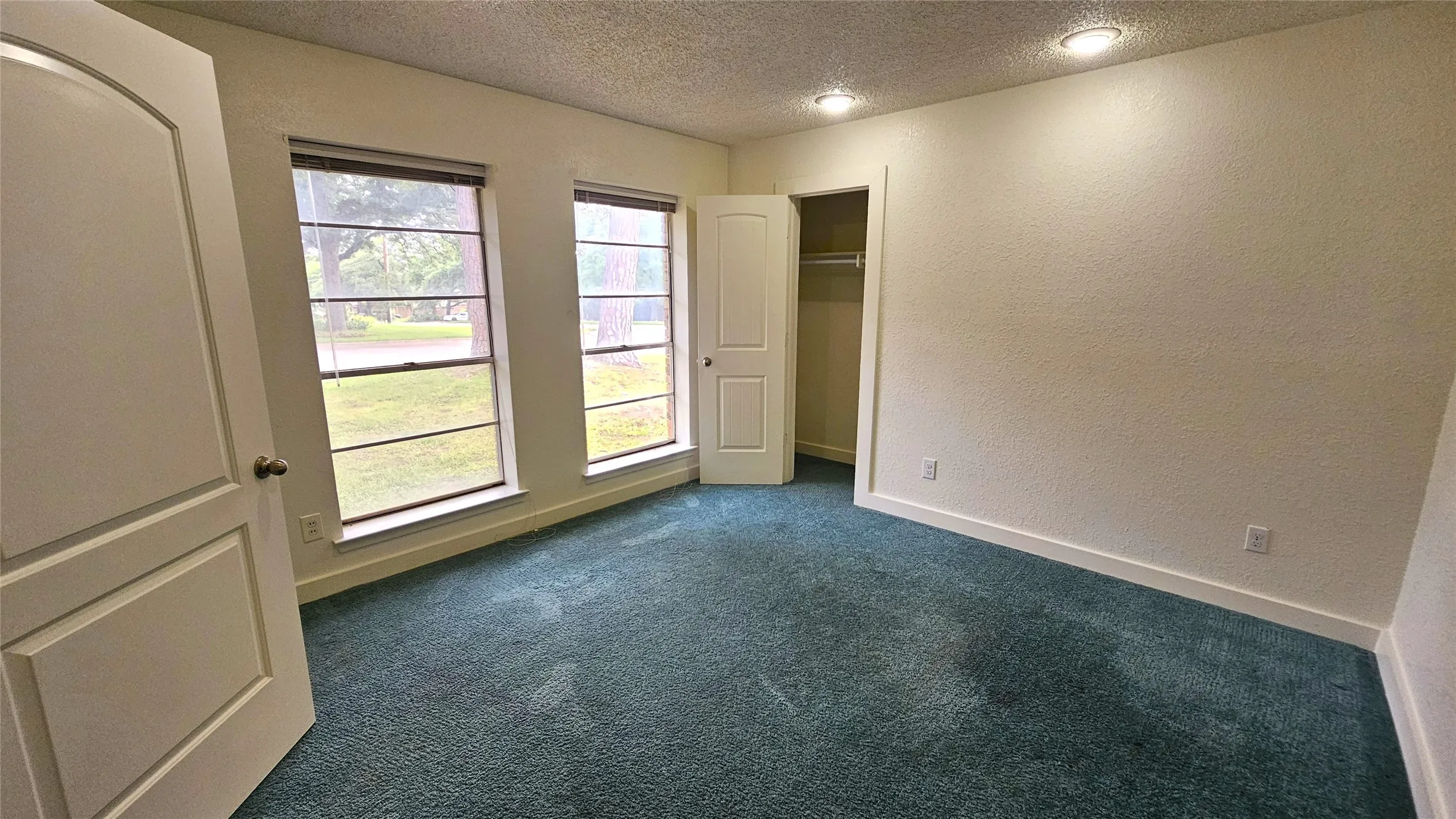 Bedroom 2 with views of the front yard