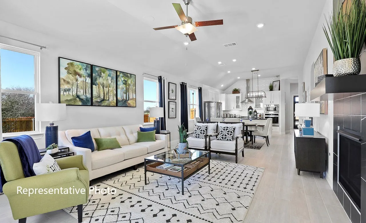Open-concept living space with light-tone wood-finish flooring