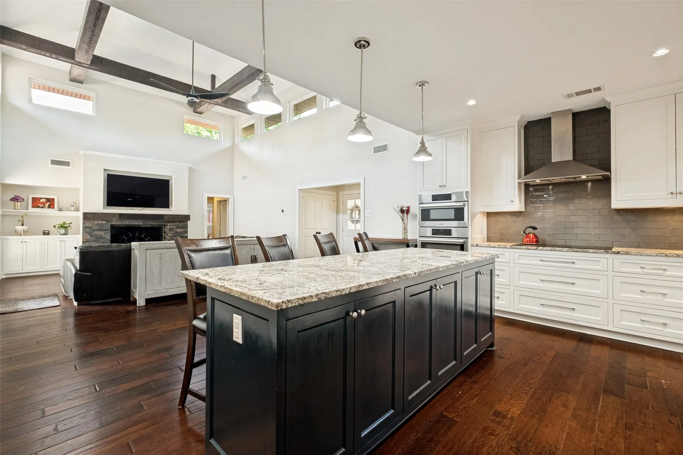 Plenty of room to put a long dining table between the bar and the living room console