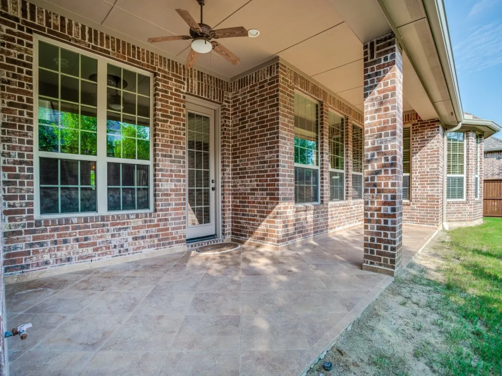     Covered back patio perfect for relaxing, dining, or entertaining.