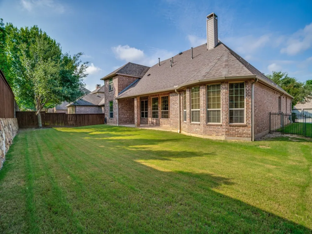     Large private backyard with plenty of room for play, pets, or outdoor gatherings.