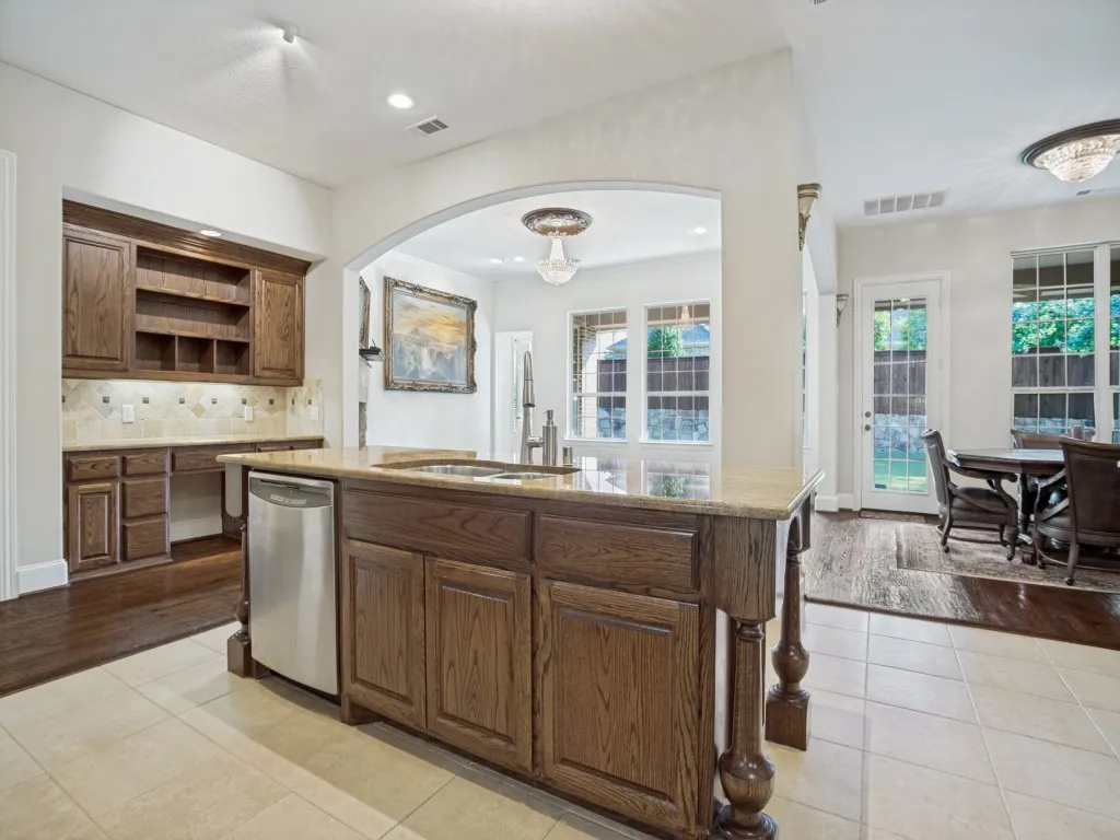     Spacious kitchen featuring a built-in planning center, perfect for organizing schedules, homework, or a home command center.