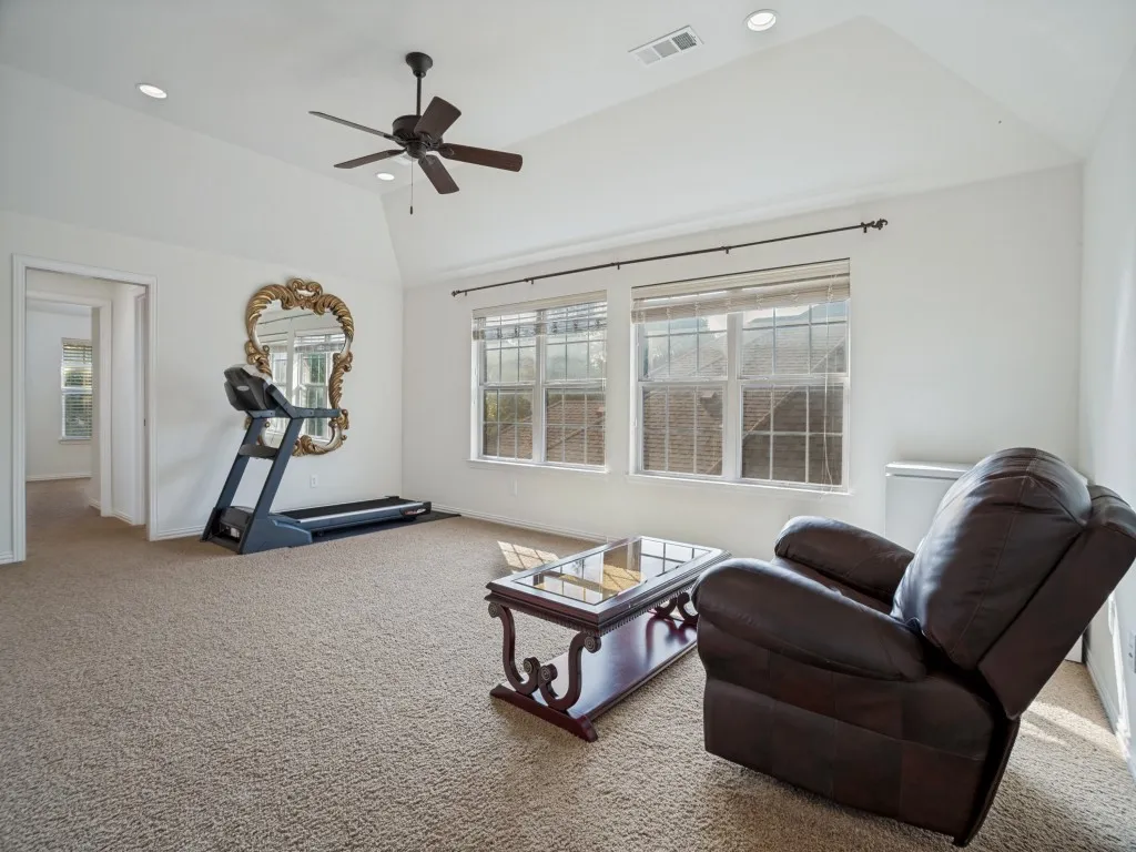     Versatile upstairs game room offering the perfect space for recreation or relaxation.