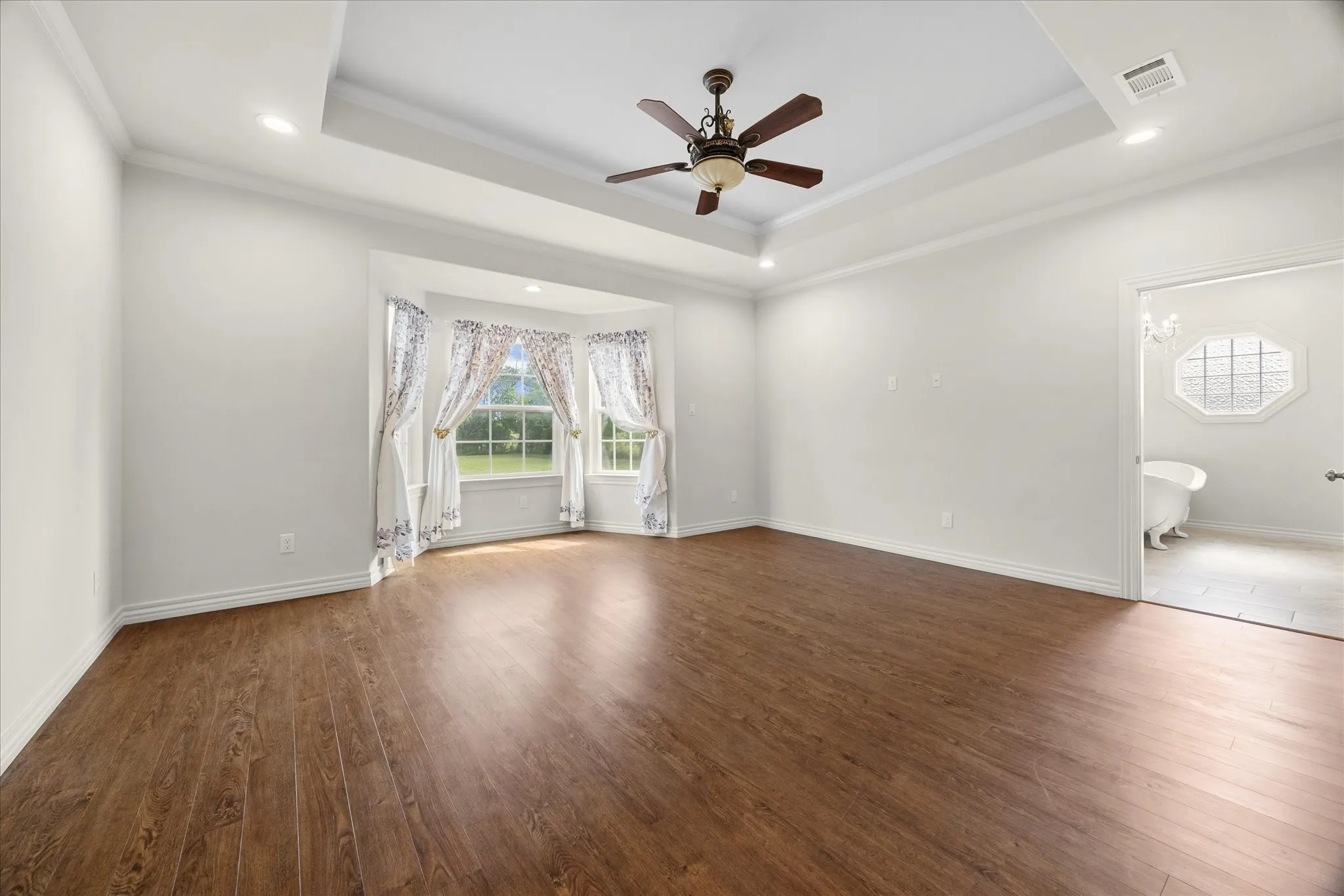 Owner's quarters includes master bedroom with tiered ceiling, sitting area with bay windows and opens onto ensuite full bath