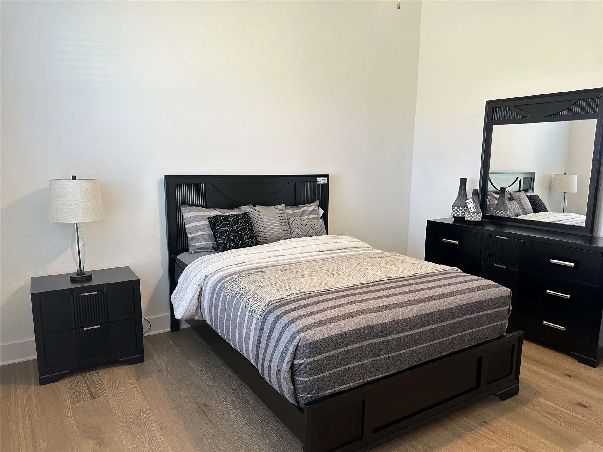 Light wood-finish flooring provides a neutral base to this room