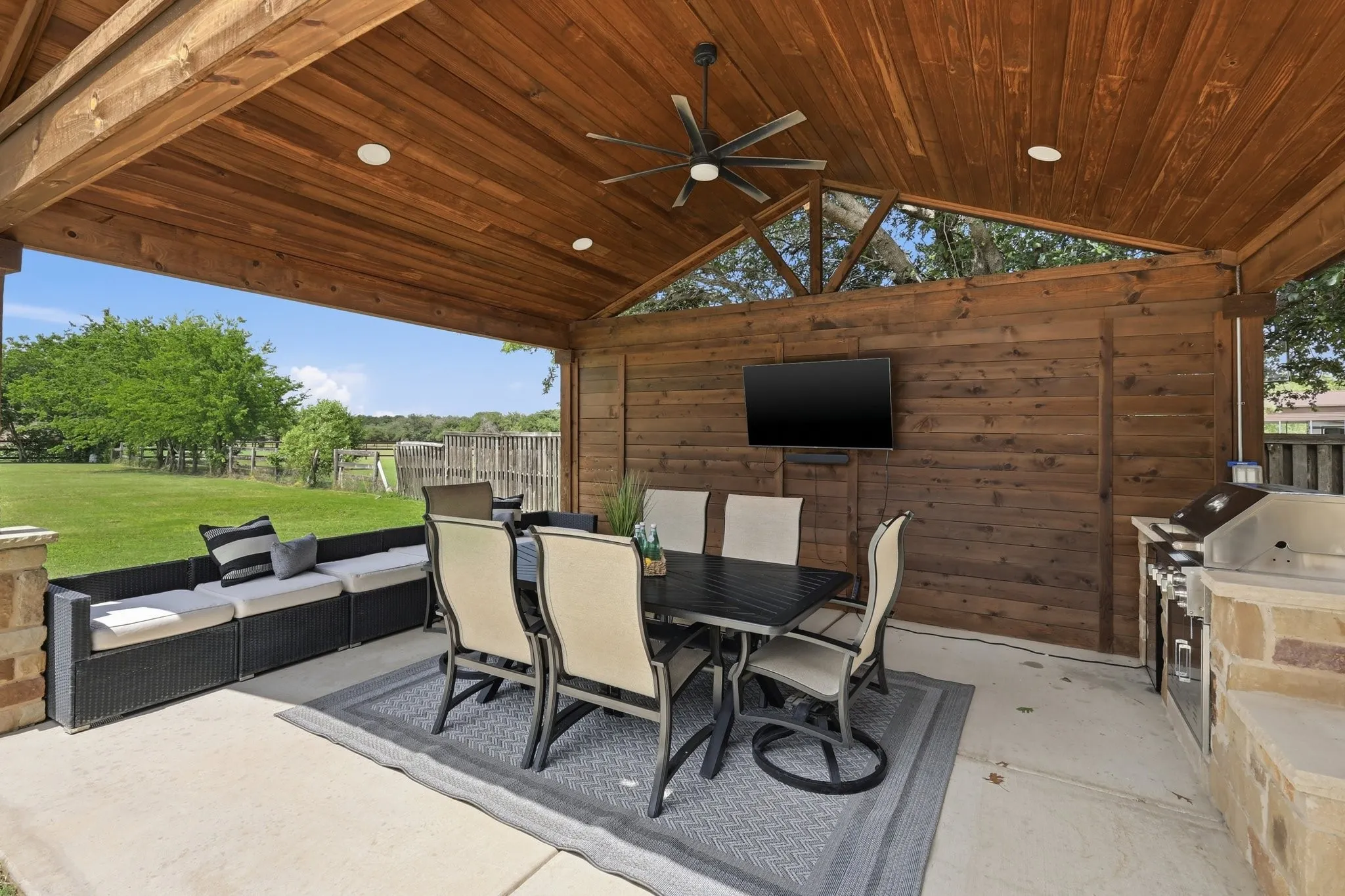 210 Canyon Oaks, Argyle, TX 76226 - Secondary suite with private entrance - Outdoor kitchen - Expansive covered patio featuring a wood-plank ceiling with recessed lighting and a ceiling fan