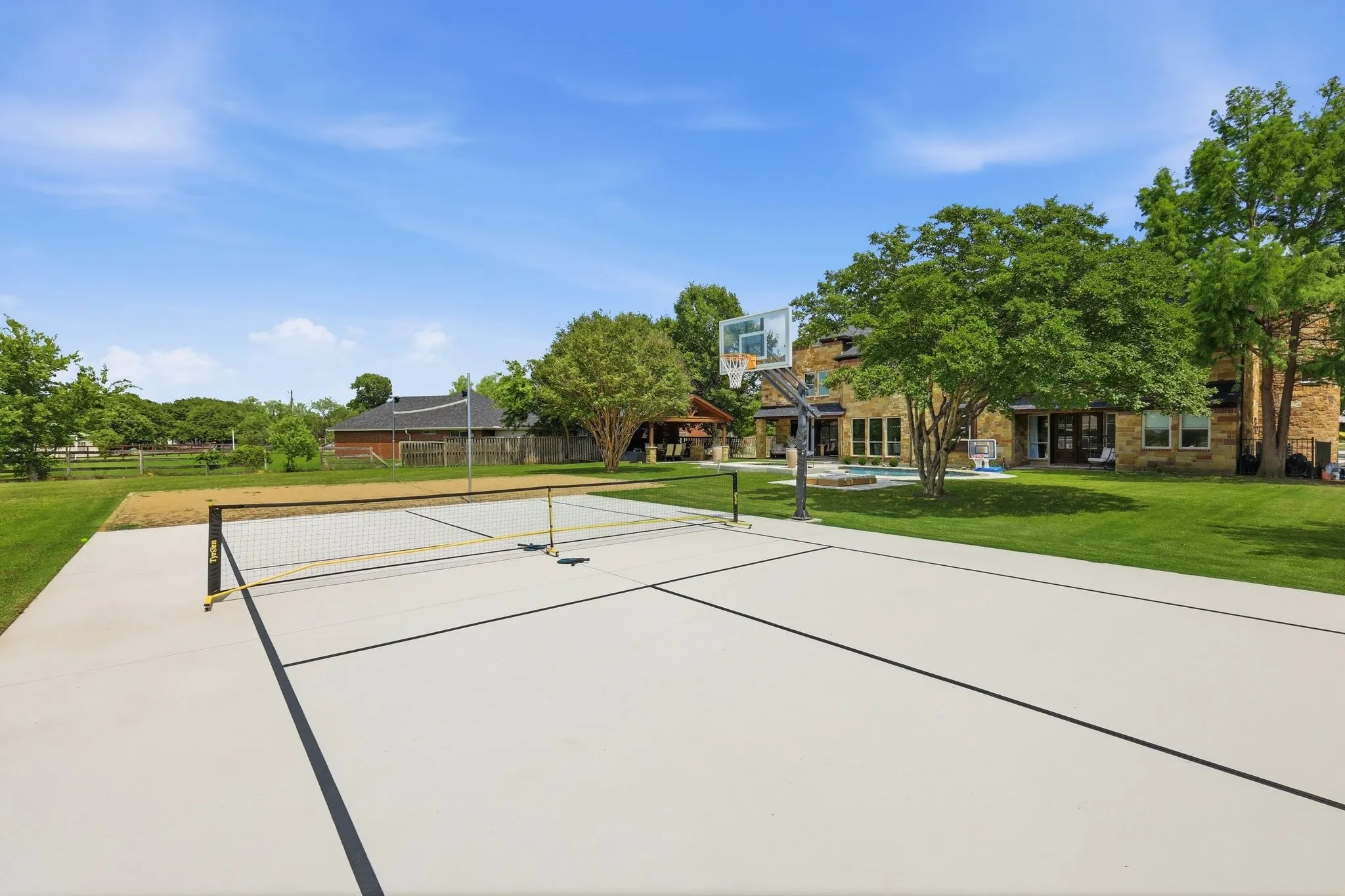 210 Canyon Oaks, Argyle, TX 76226 - Secondary suite with private entrance - Sports court - Outdoor sports court featuring defined lines for pickleball and a basketball hoop