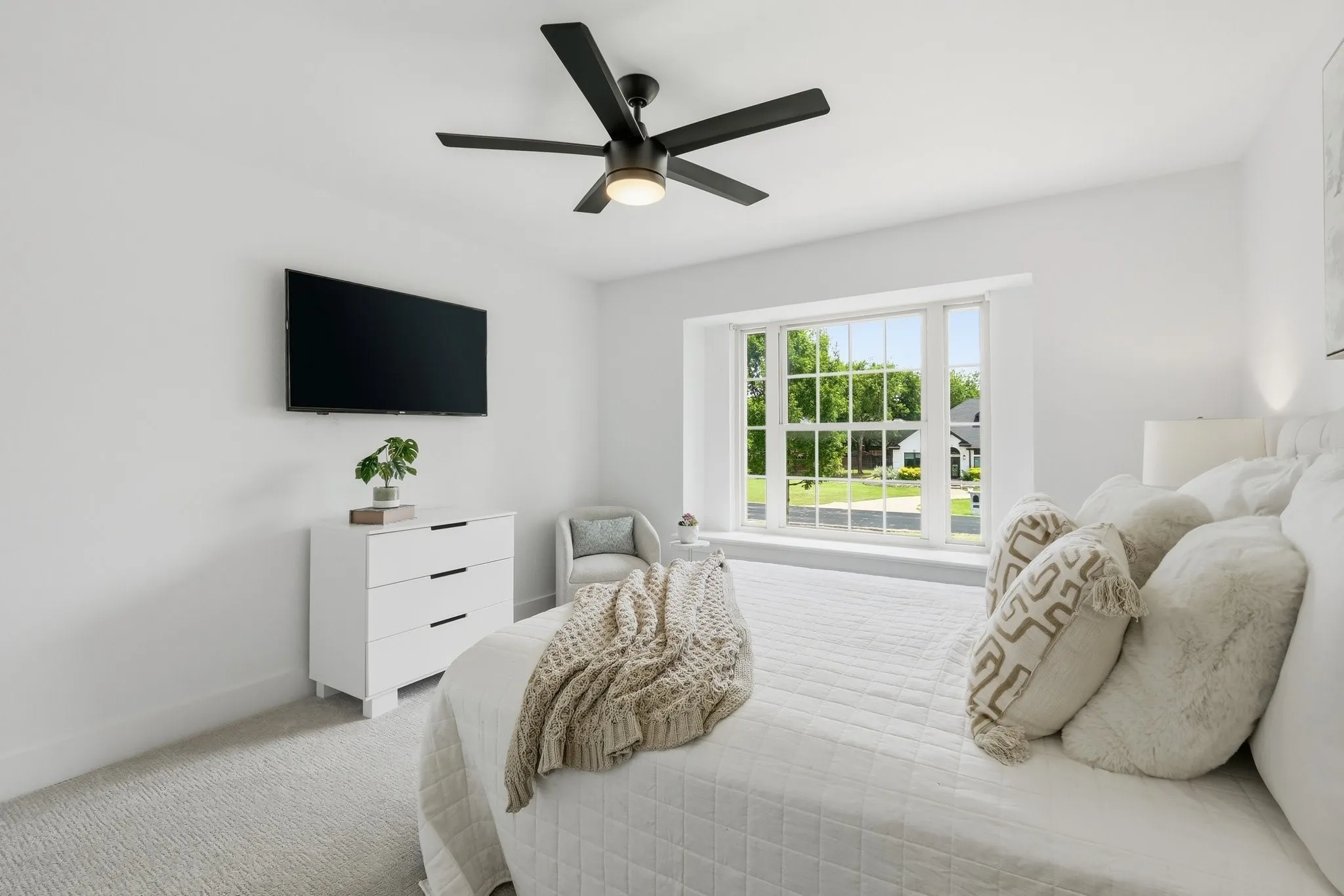 210 Canyon Oaks, Argyle, TX 76226 - Bedroom - another spacious room featuring light-toned carpet flooring, a large bay window, and a contemporary ceiling fan