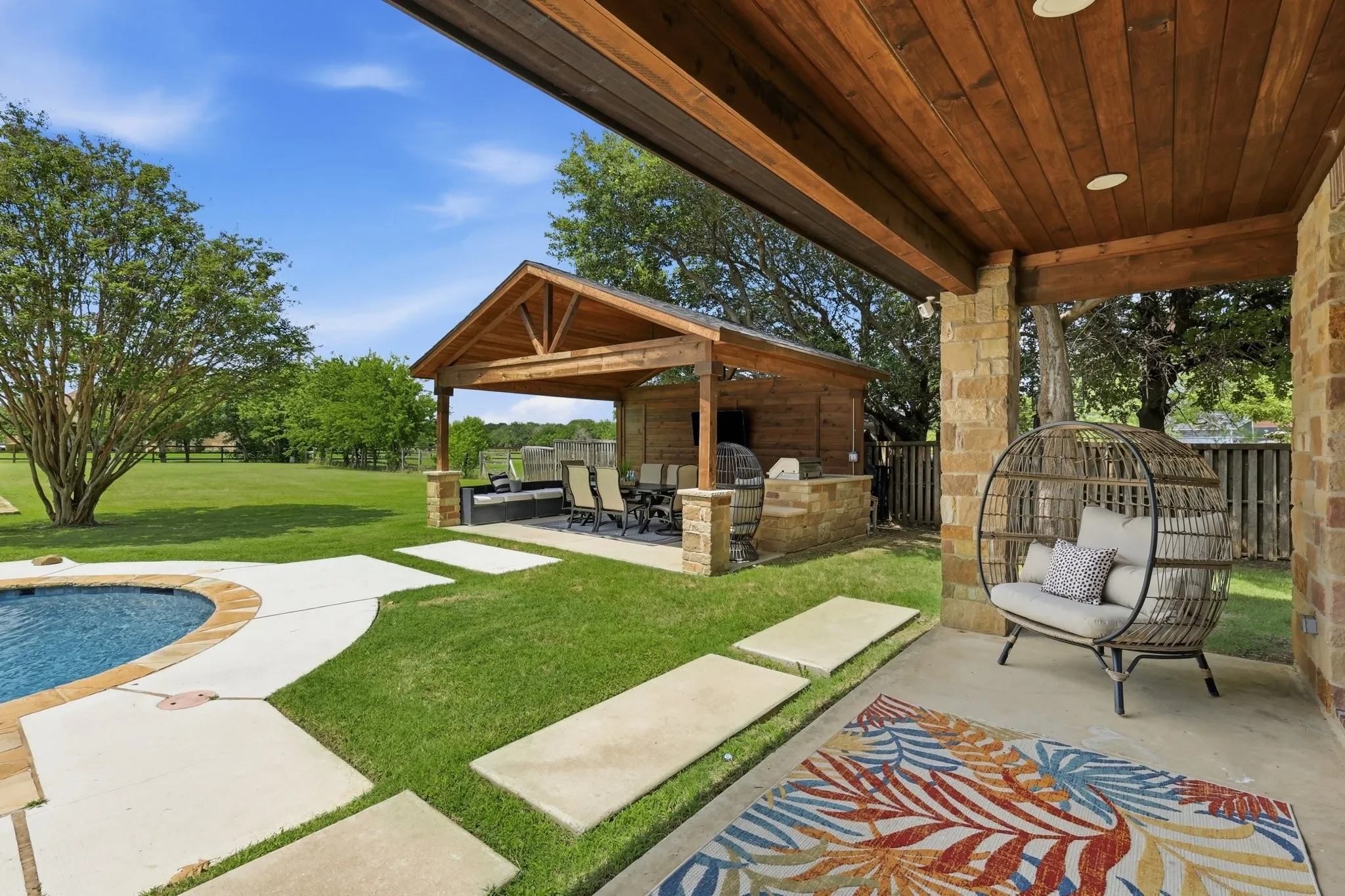 210 Canyon Oaks, Argyle, TX 76226 - Covered patio overlooking sparkling pool, and yard.