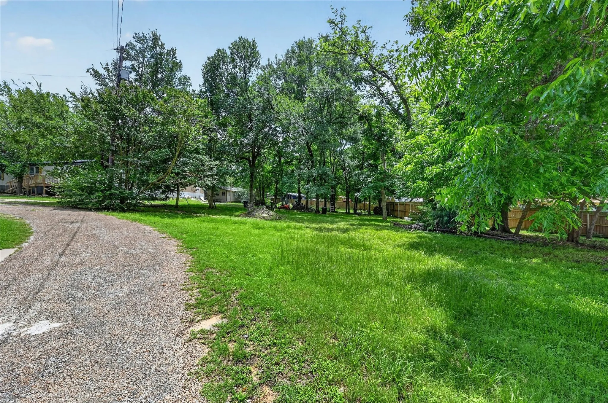 To the right of the driveway, Lots 143-145