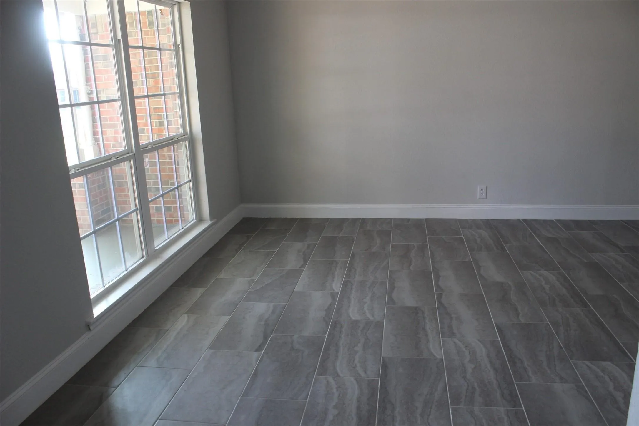 Light gray walls complemented by white baseboards