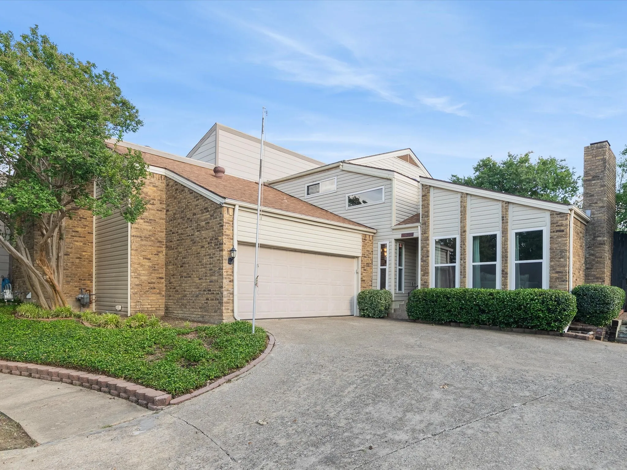 Contemporary architecture featuring brick and siding facade