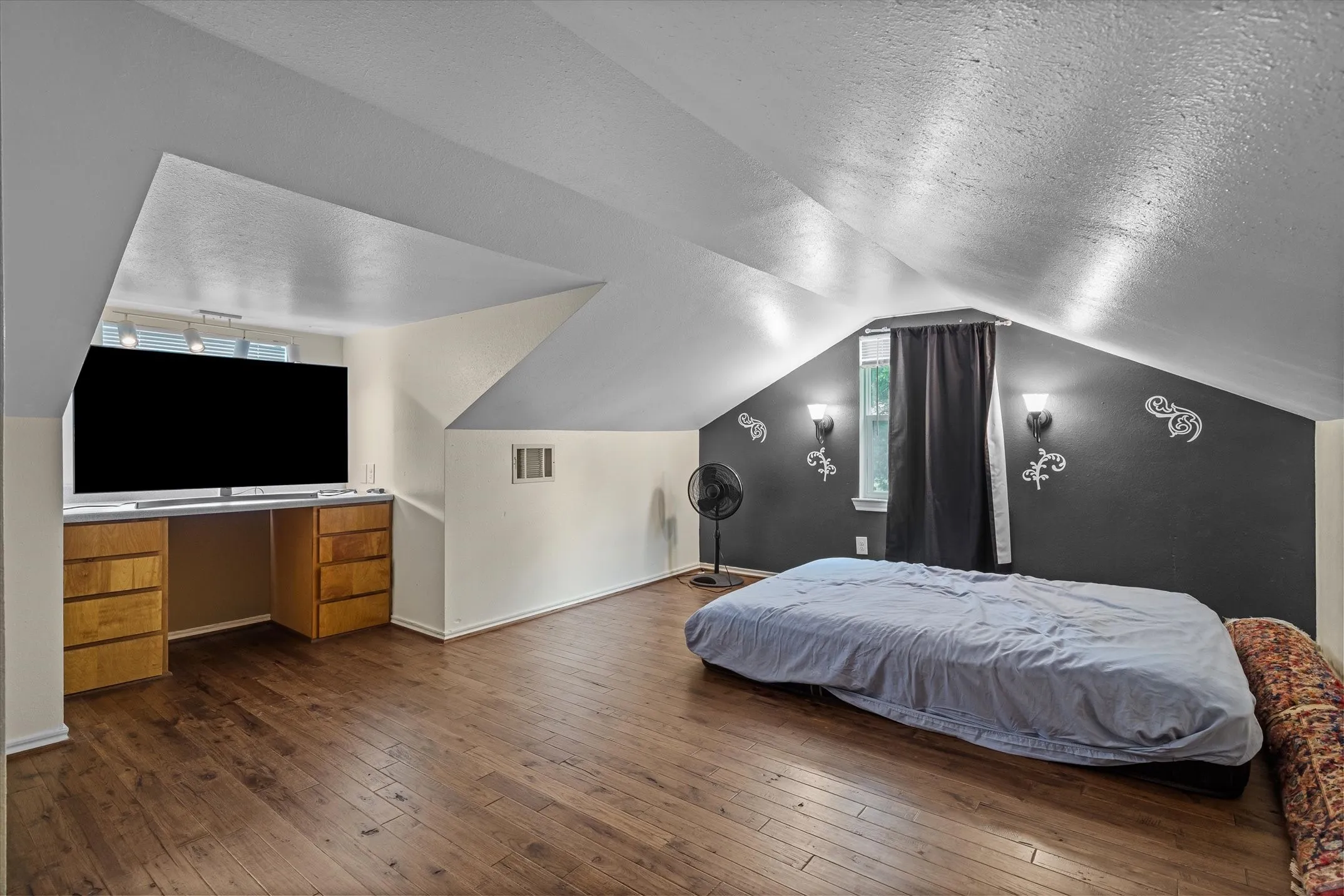 This bonus room upstairs can be a bedroom, game room or private guest room