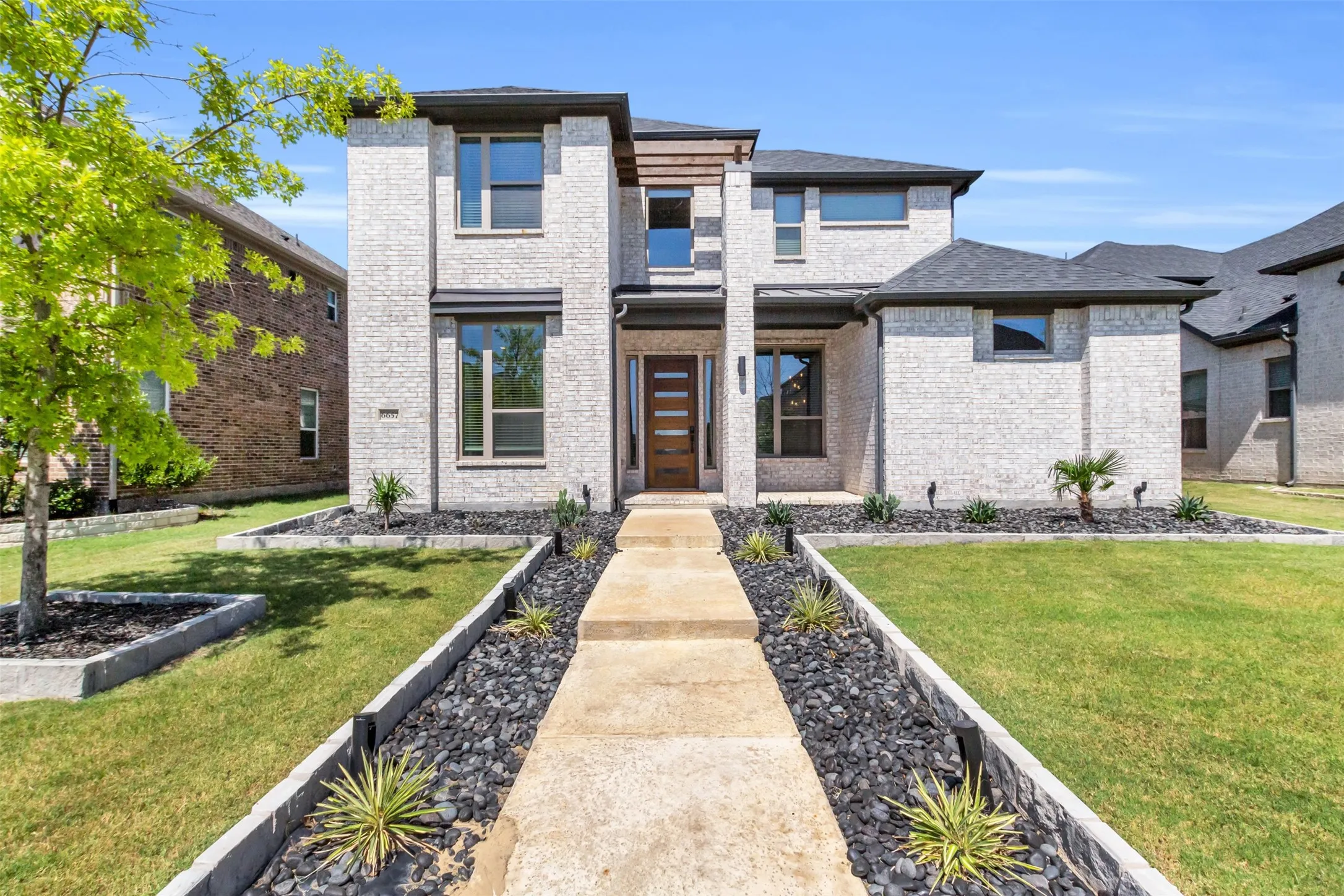 View of front of property featuring a front lawn