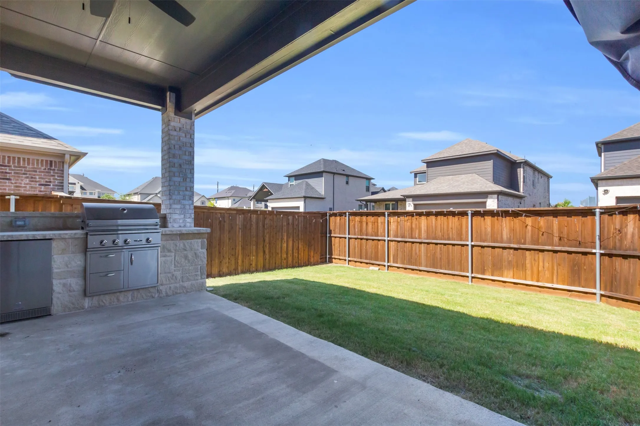 View of yard with a patio and exterior kitchen
