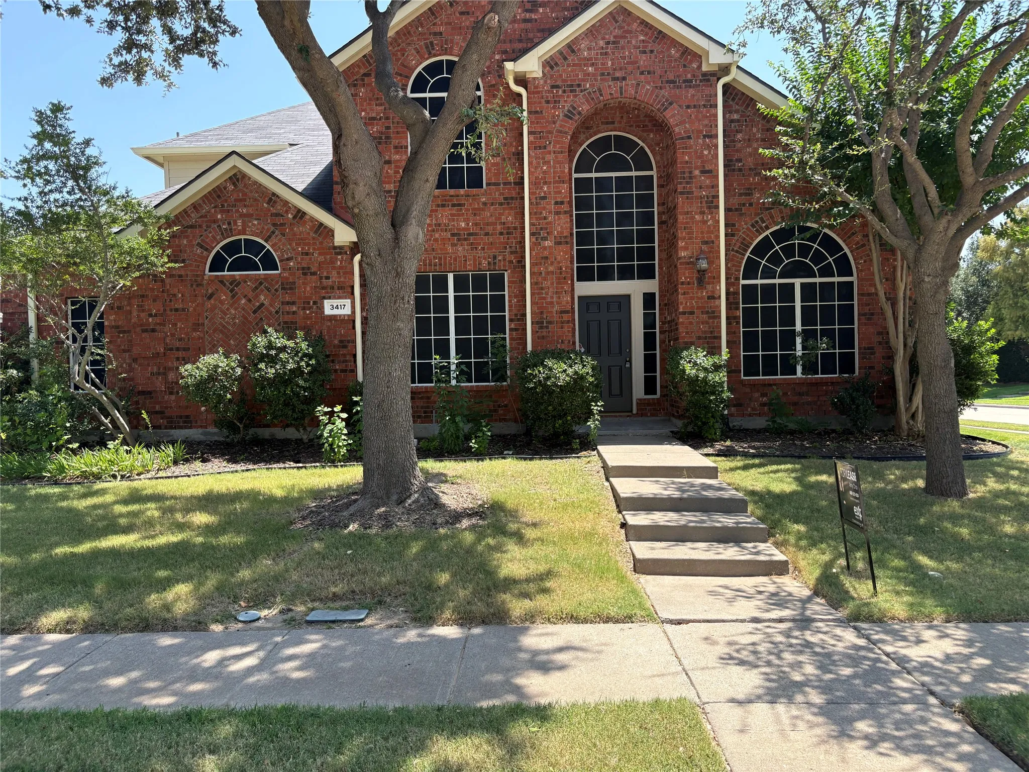 Traditional brick facade featuring arched windows