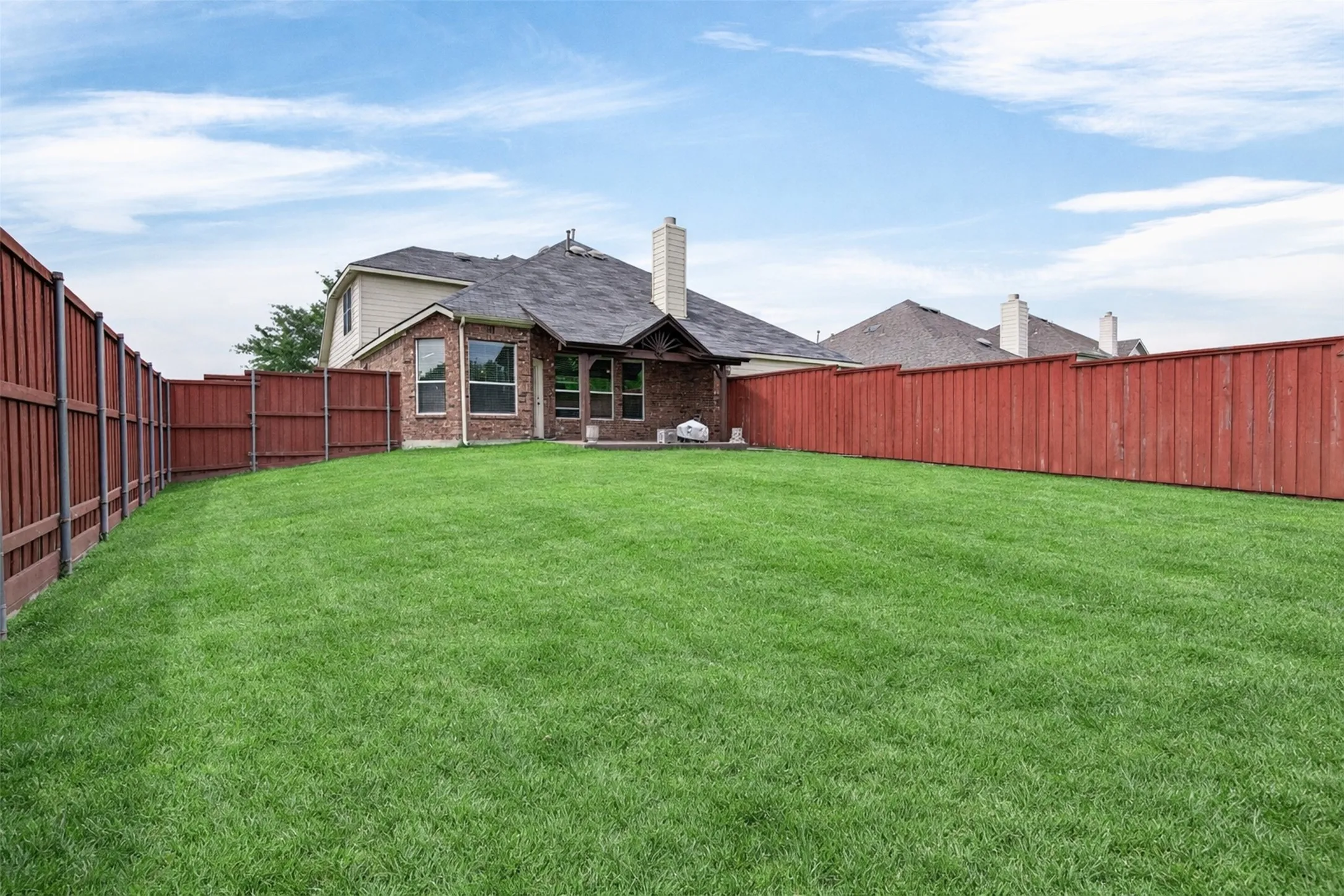 Expansive green lawn providing ample outdoor space