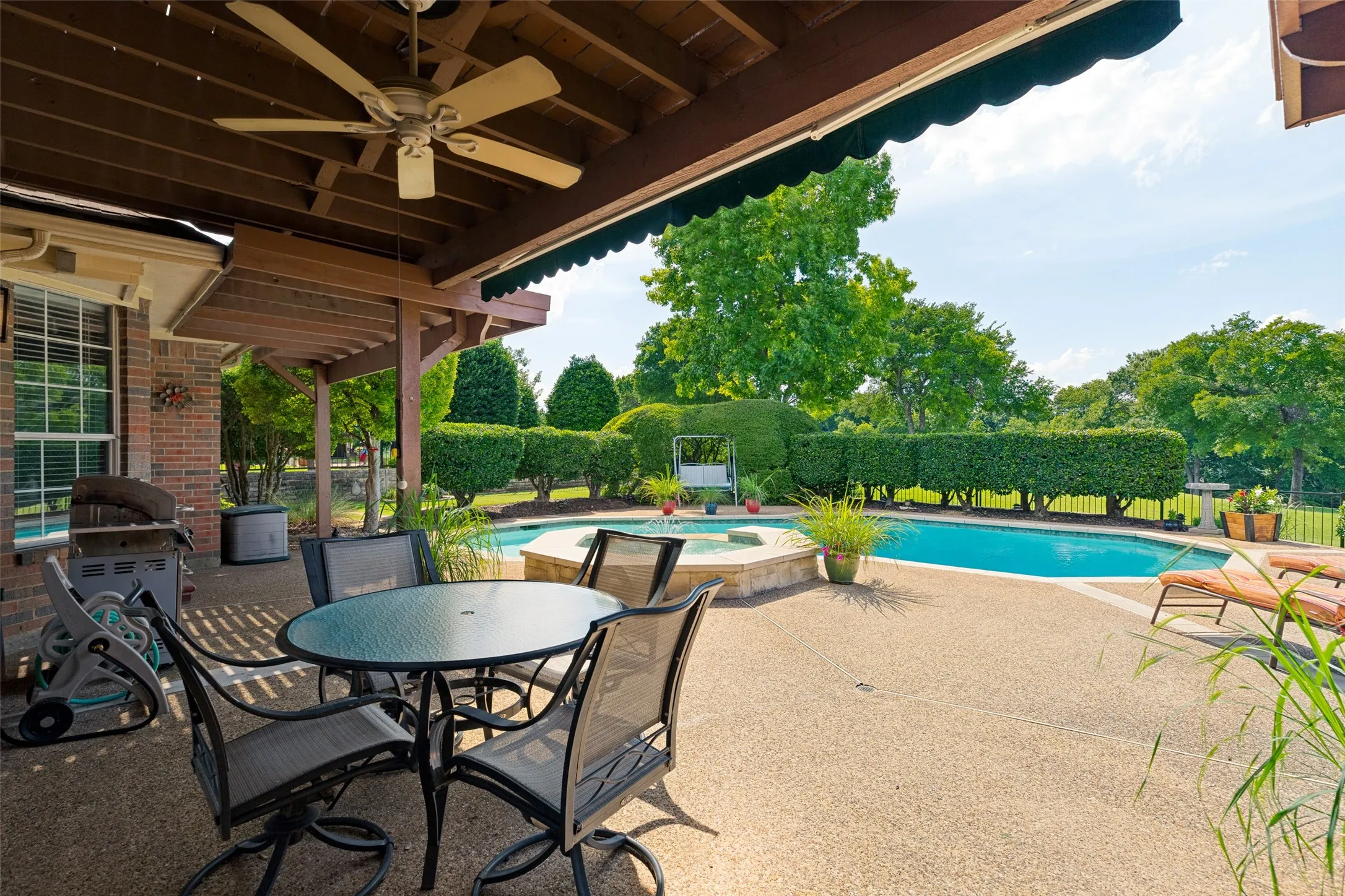 Covered patio and awning to help with summer heat - however the pool is the best place to cool off!