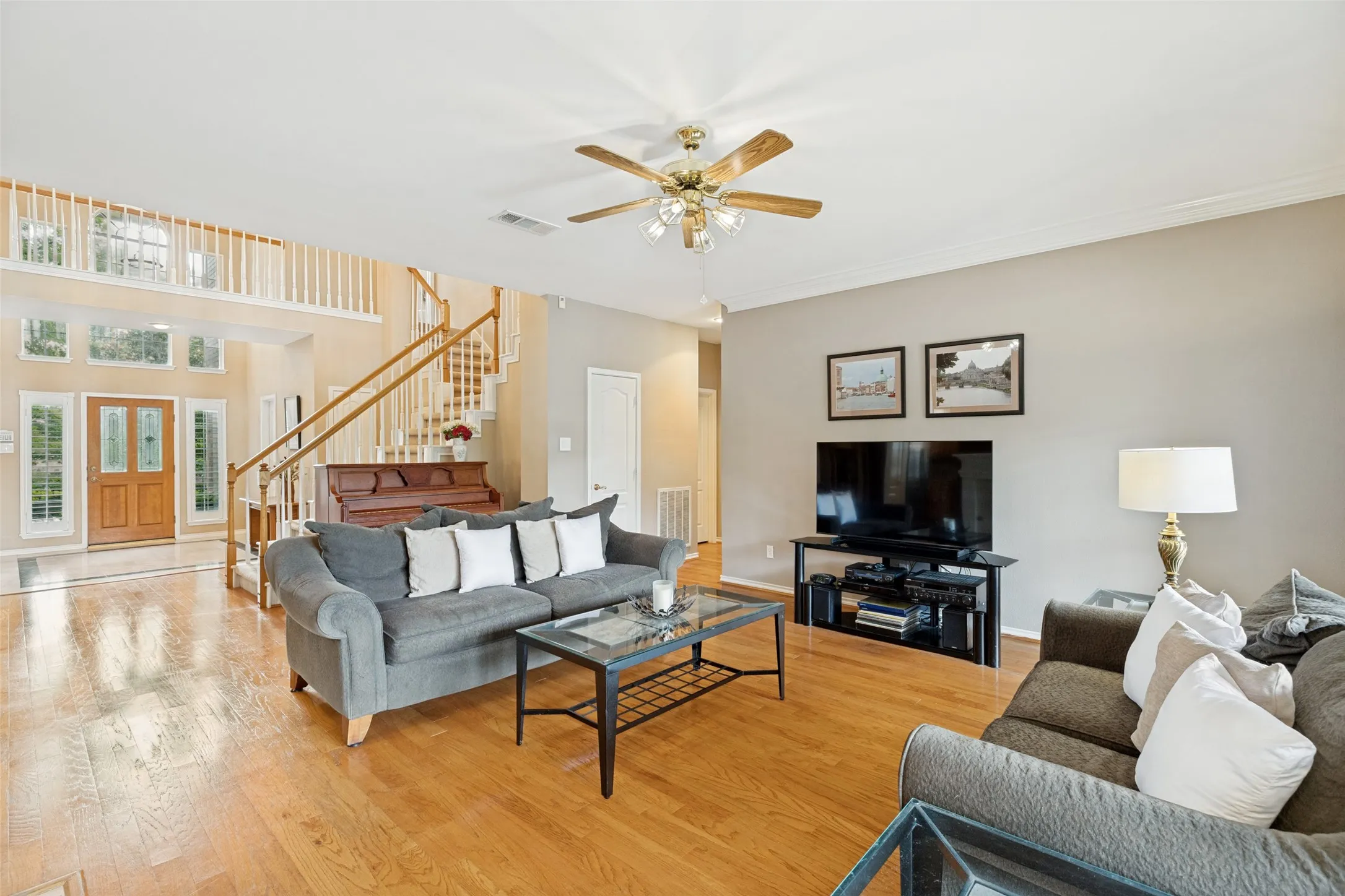 The entry into the Living Room.  Wood floors are throughout 2 living rooms, dining room, and kitchen.