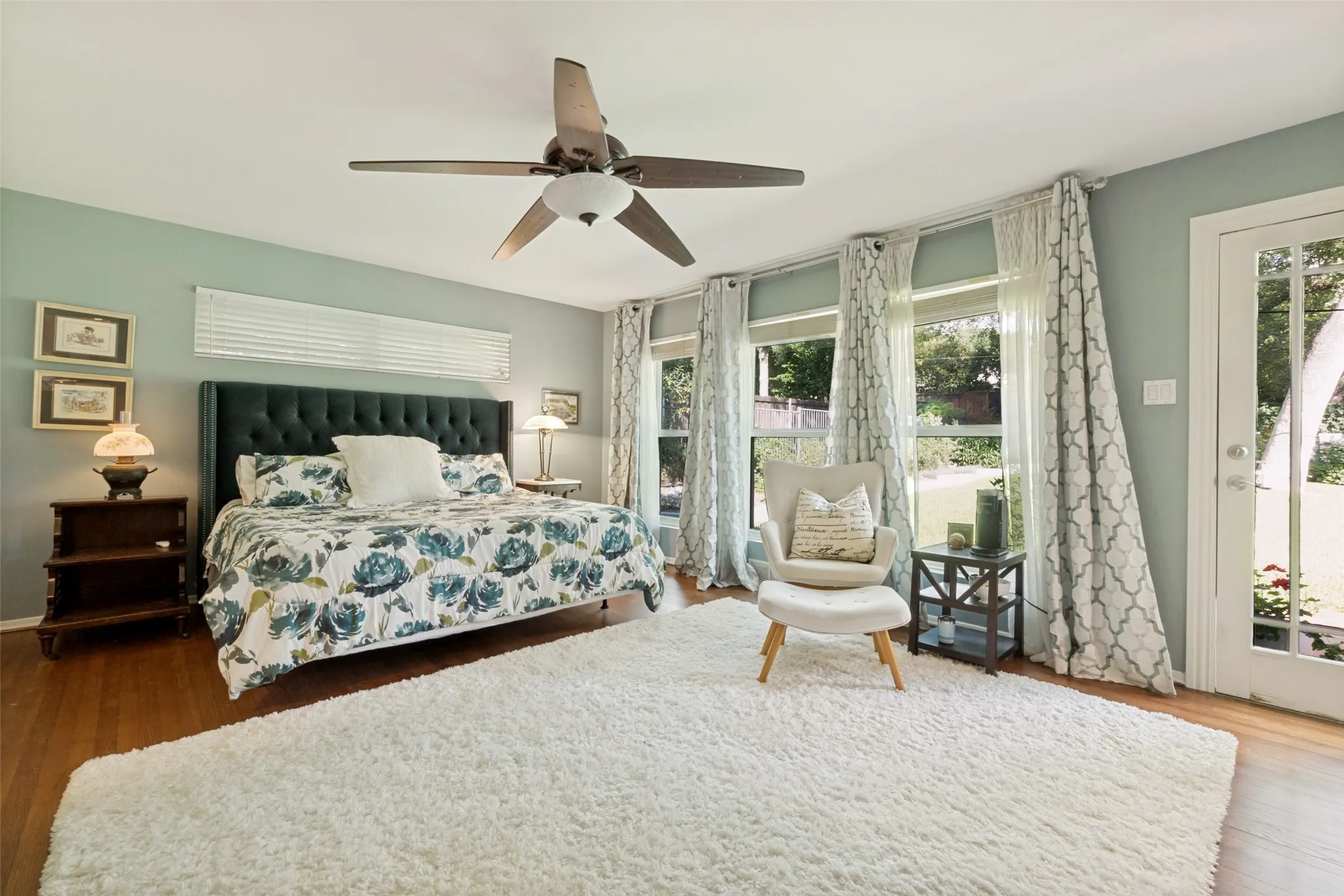 Serene master bedroom with view of backyard