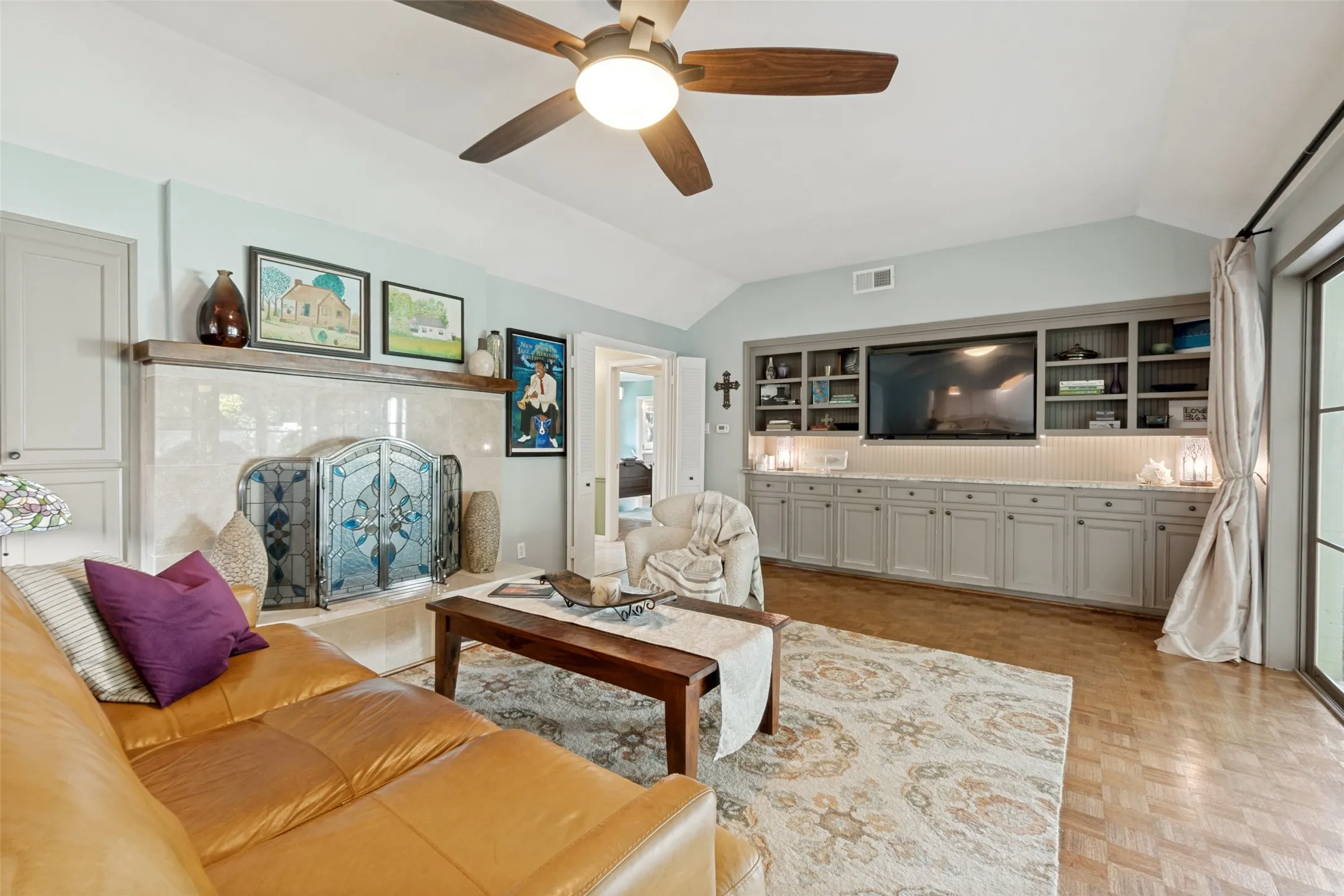 featuring hardwood floors and a wood burning fireplace