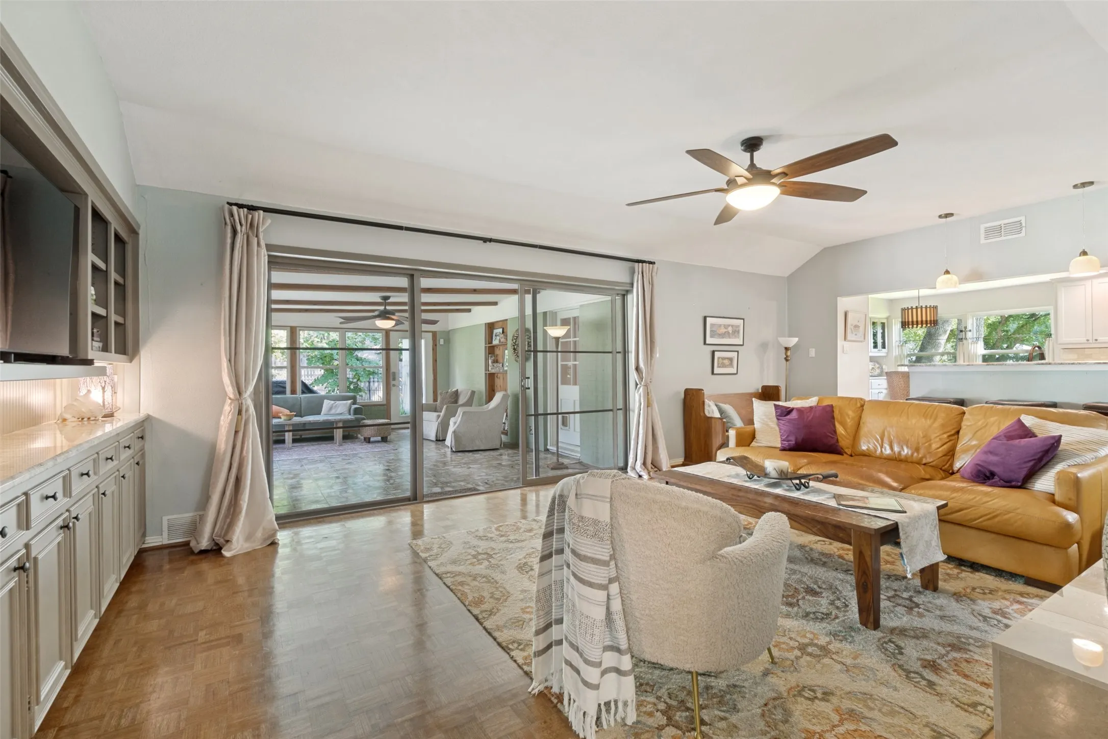 Living area overlooking bonus sun room space where you will spend a lot of time