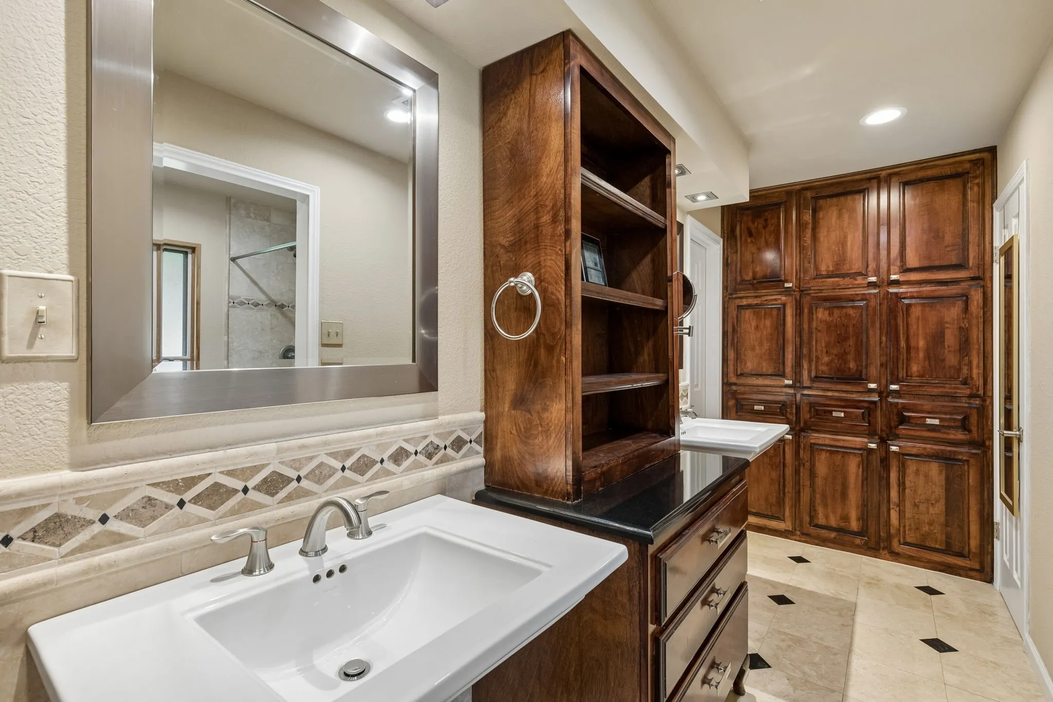 huge primary bath with 2 walk in closets for hers/hims