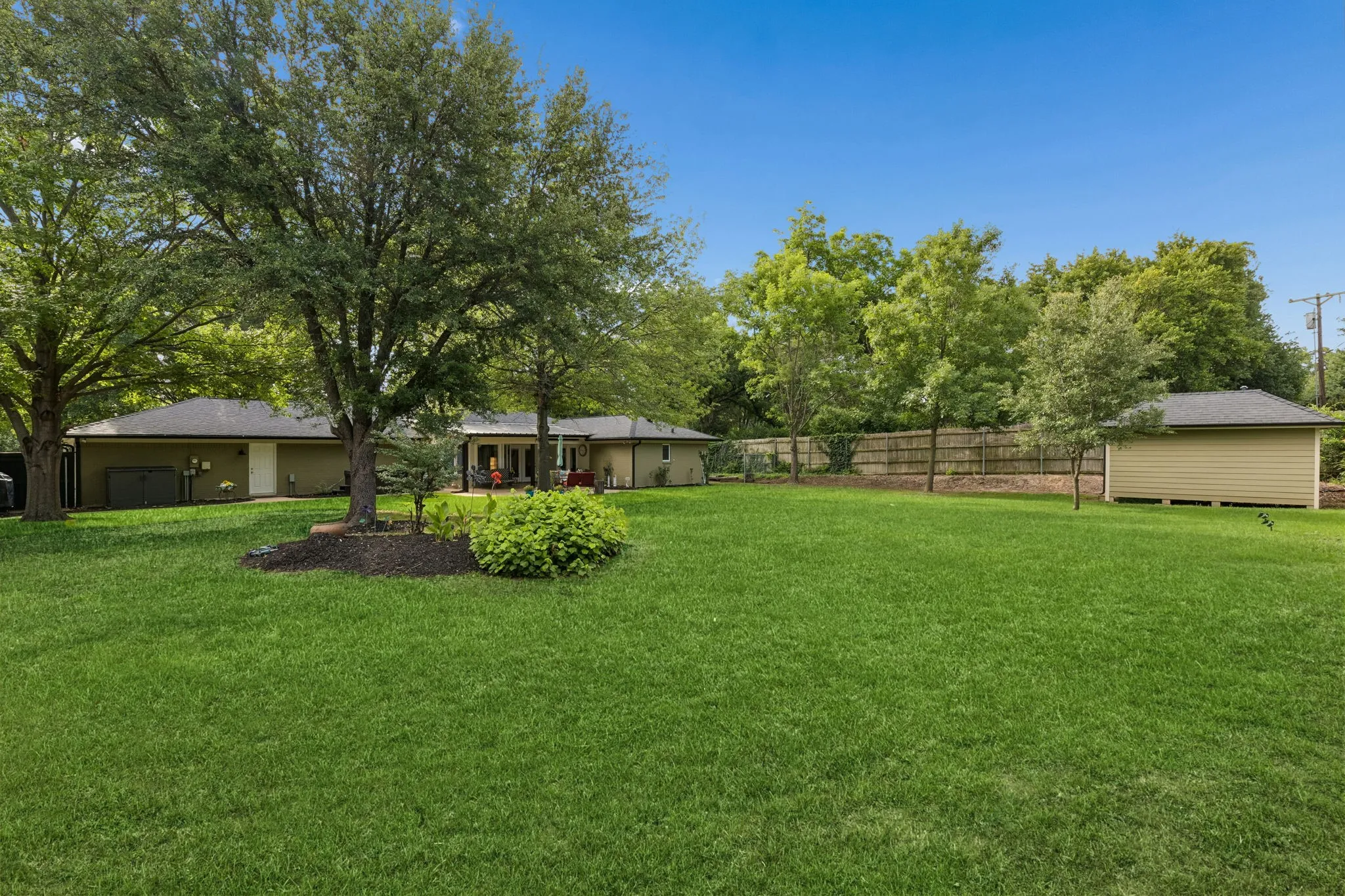 huge backyard on nearly .71 acre with a 8X16 outdoor shed to the right.