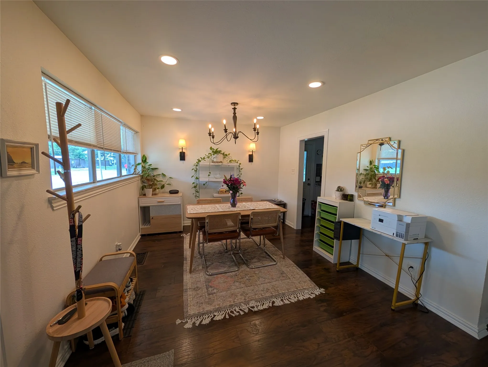 Open-concept living space with dark wood-finish flooring