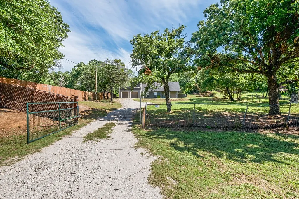 Driveway with electric entry to gate with keypad.