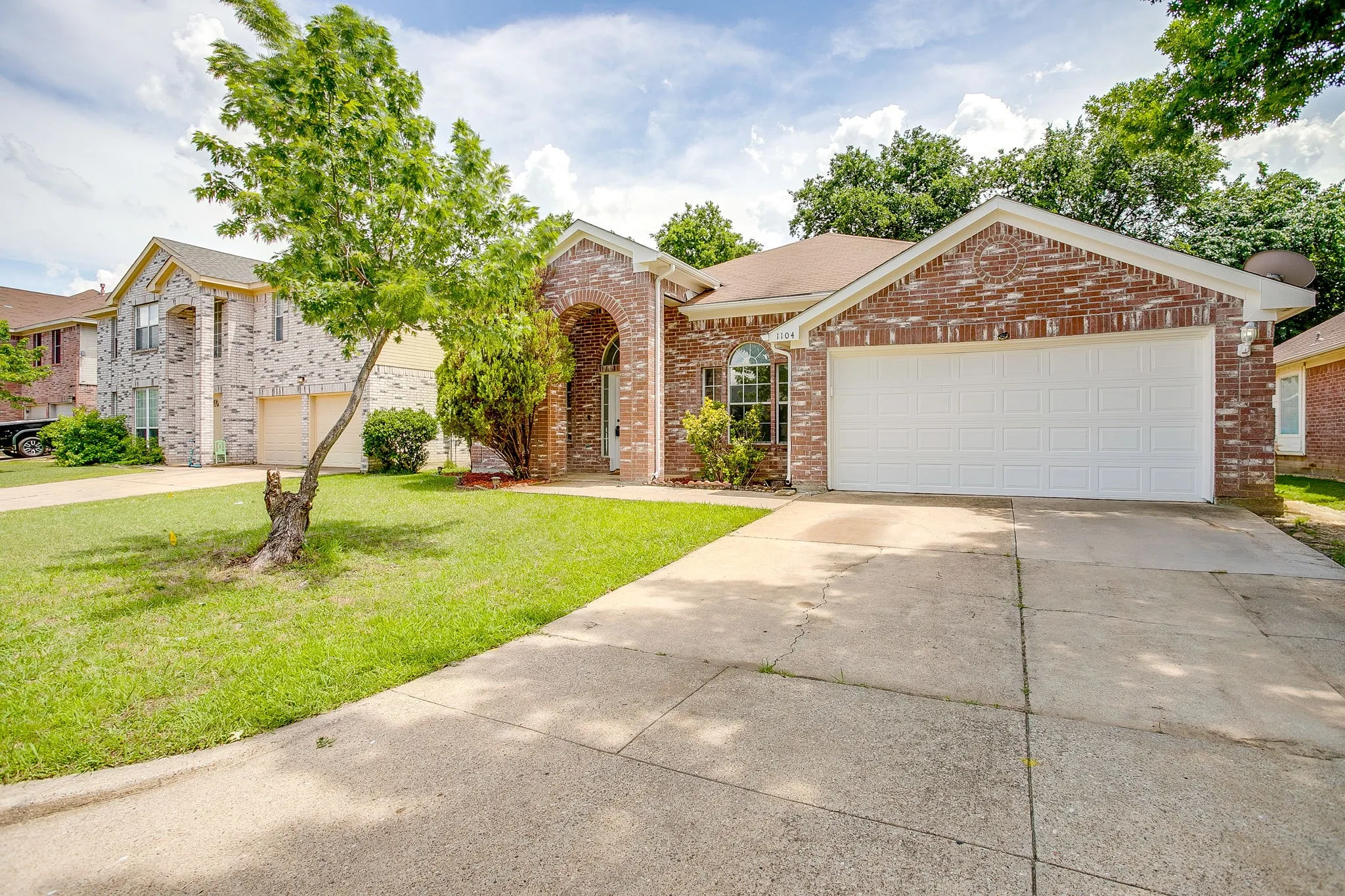 This one level home features a multi-car driveway and established landscaping.