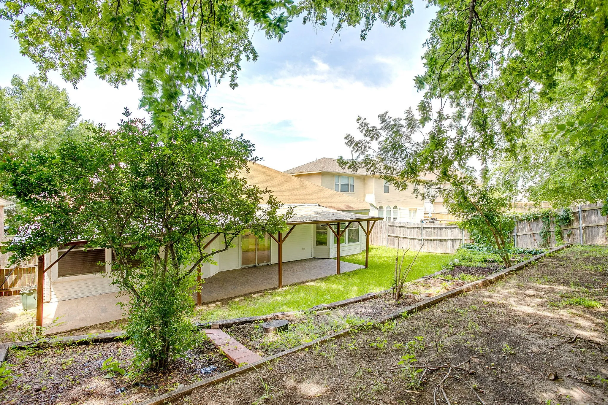 Exterior of the home featuring the expansive covered patio.