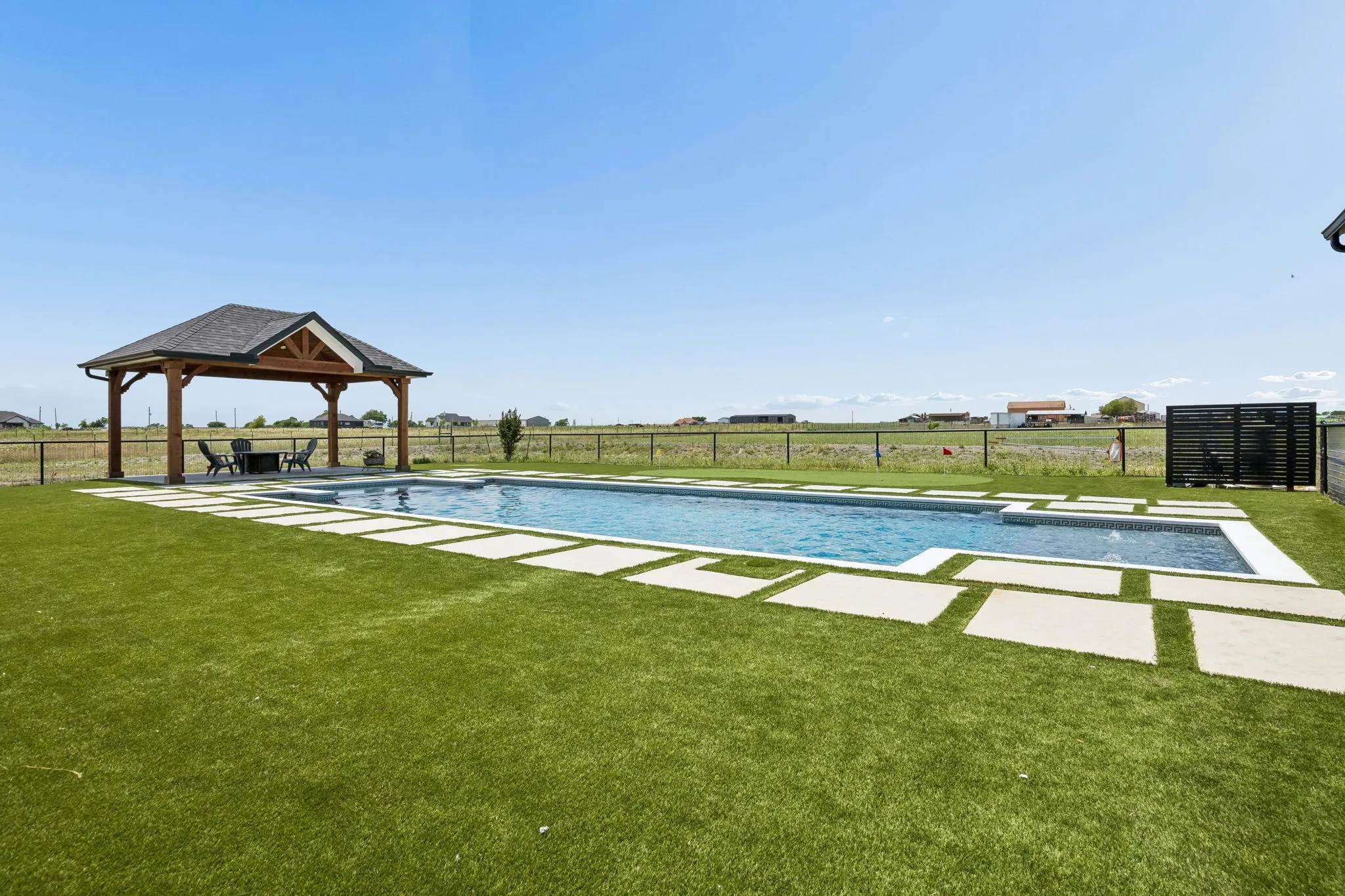 Brand new pool and spa surrounded by turf and fenced in.