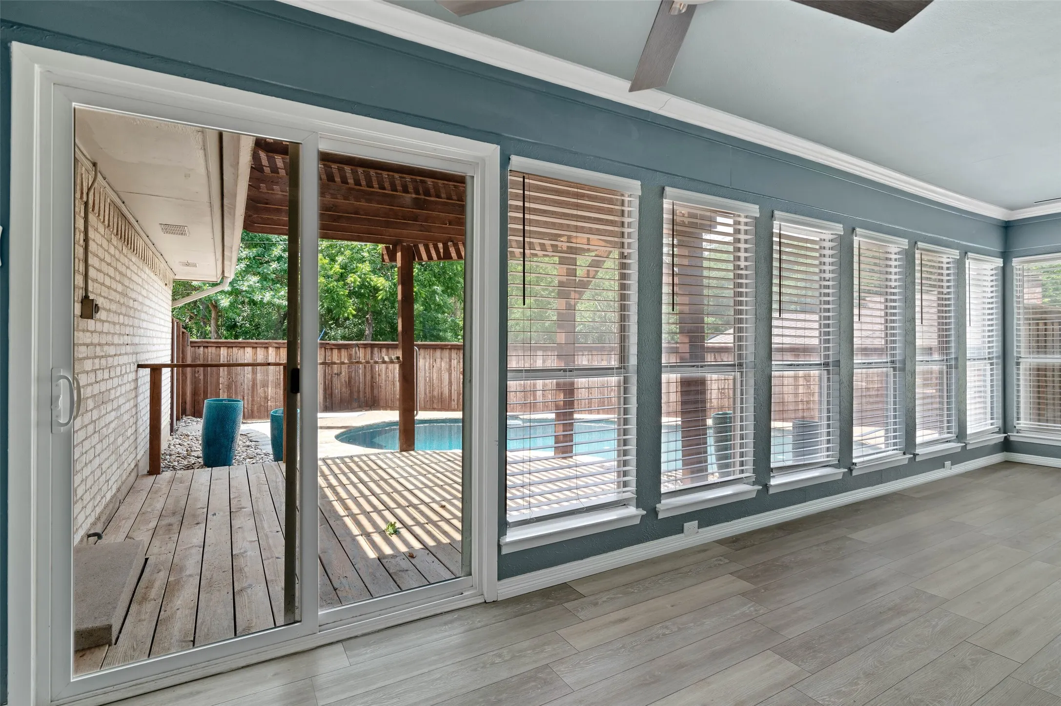 Sunroom overlooks the pool