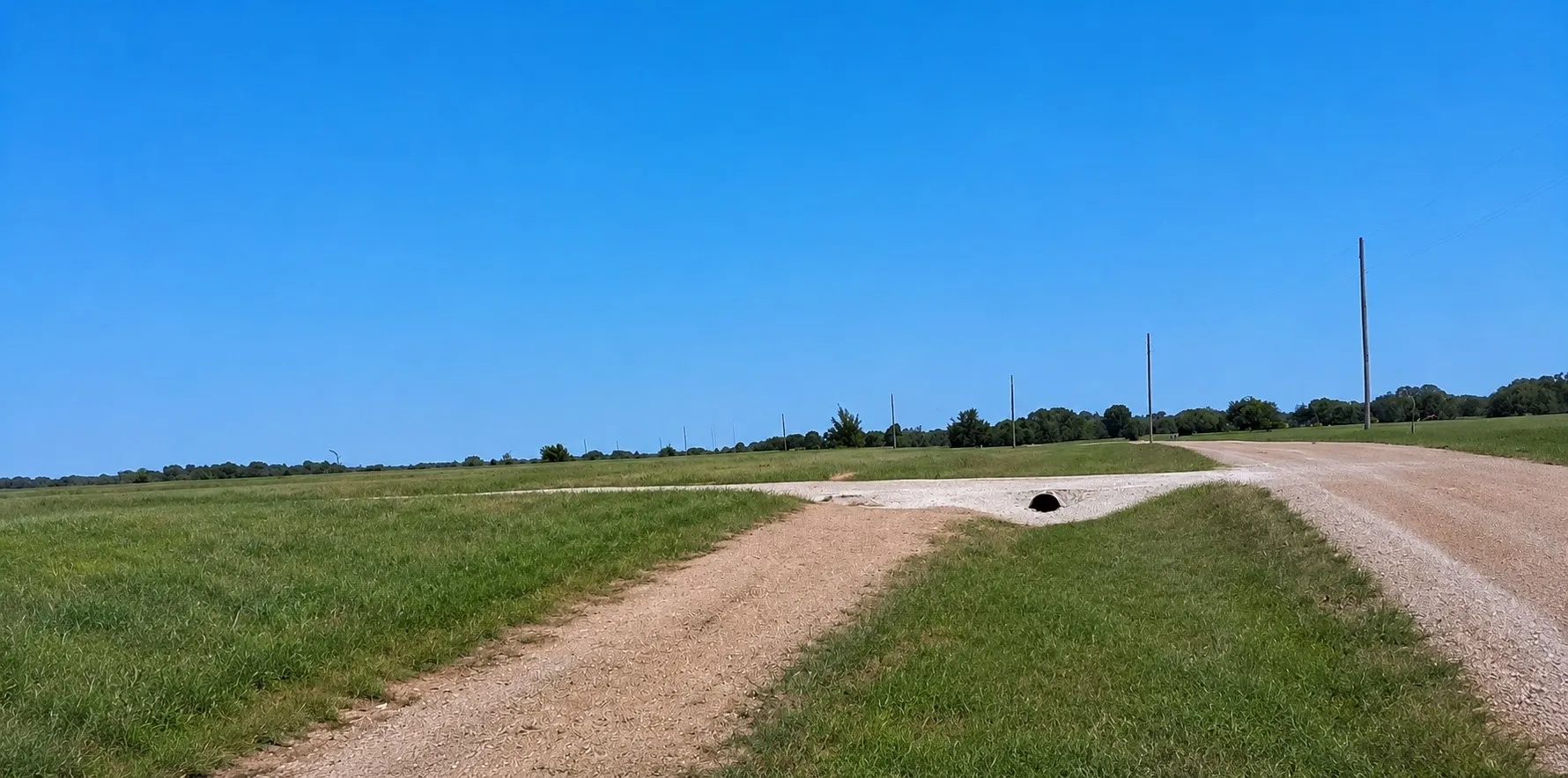 Existing driveway and culvert provide a head start for your future barndominium or custom home build.