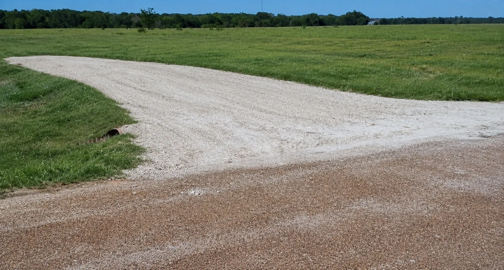 Existing driveway and culvert provide a head start for your future barndominium or custom home build.