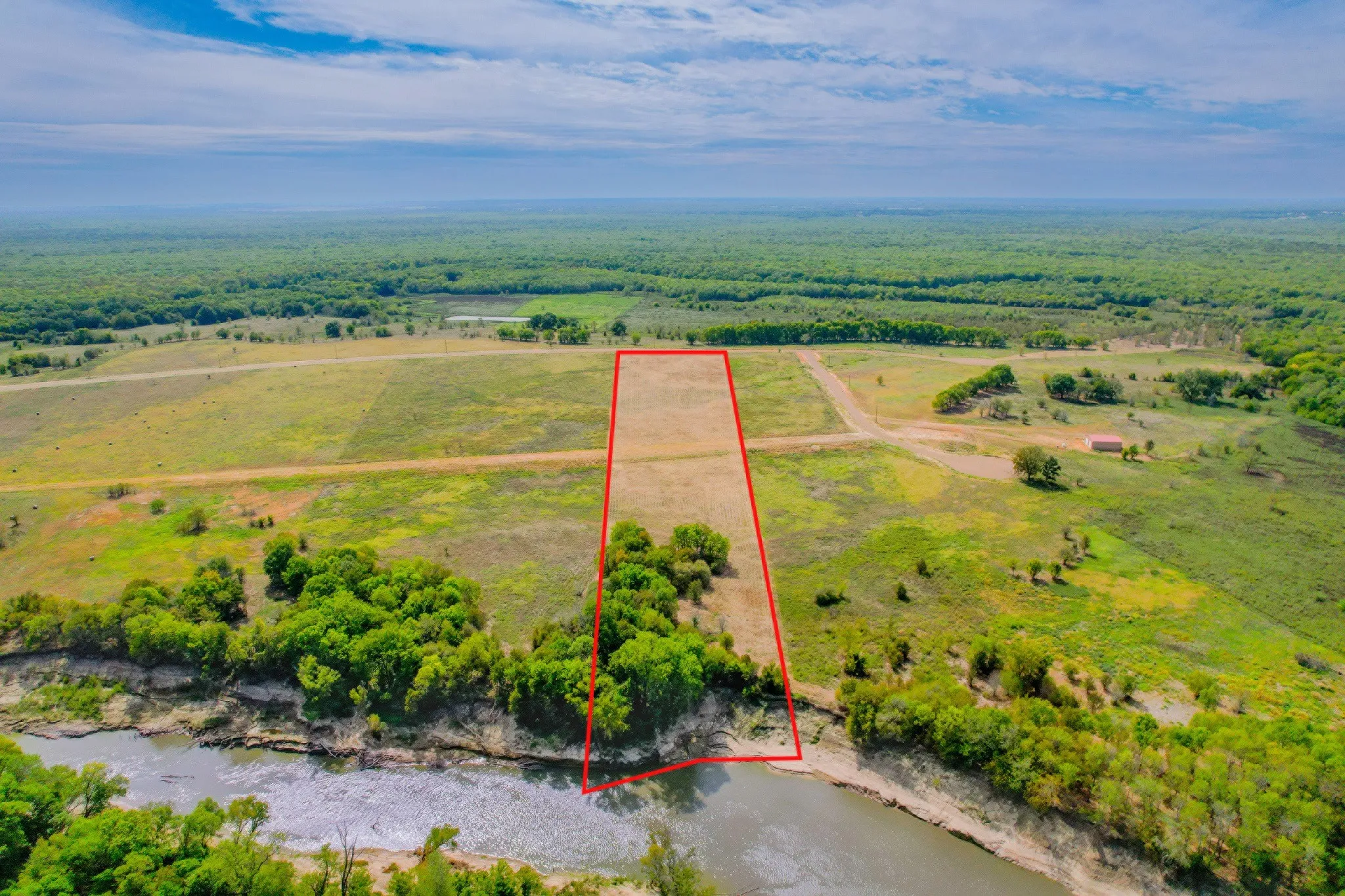 A rare opportunity to build a riverfront barndominium in one of East Texas' most scenic acreage communities.
