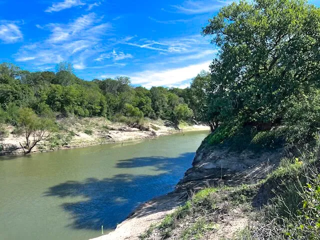 Peaceful river views make this acreage feel worlds away from city noise.