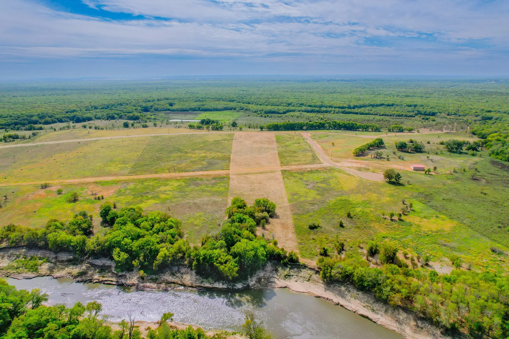 Trinity River frontage offers peaceful water views and a serene East Texas country setting.