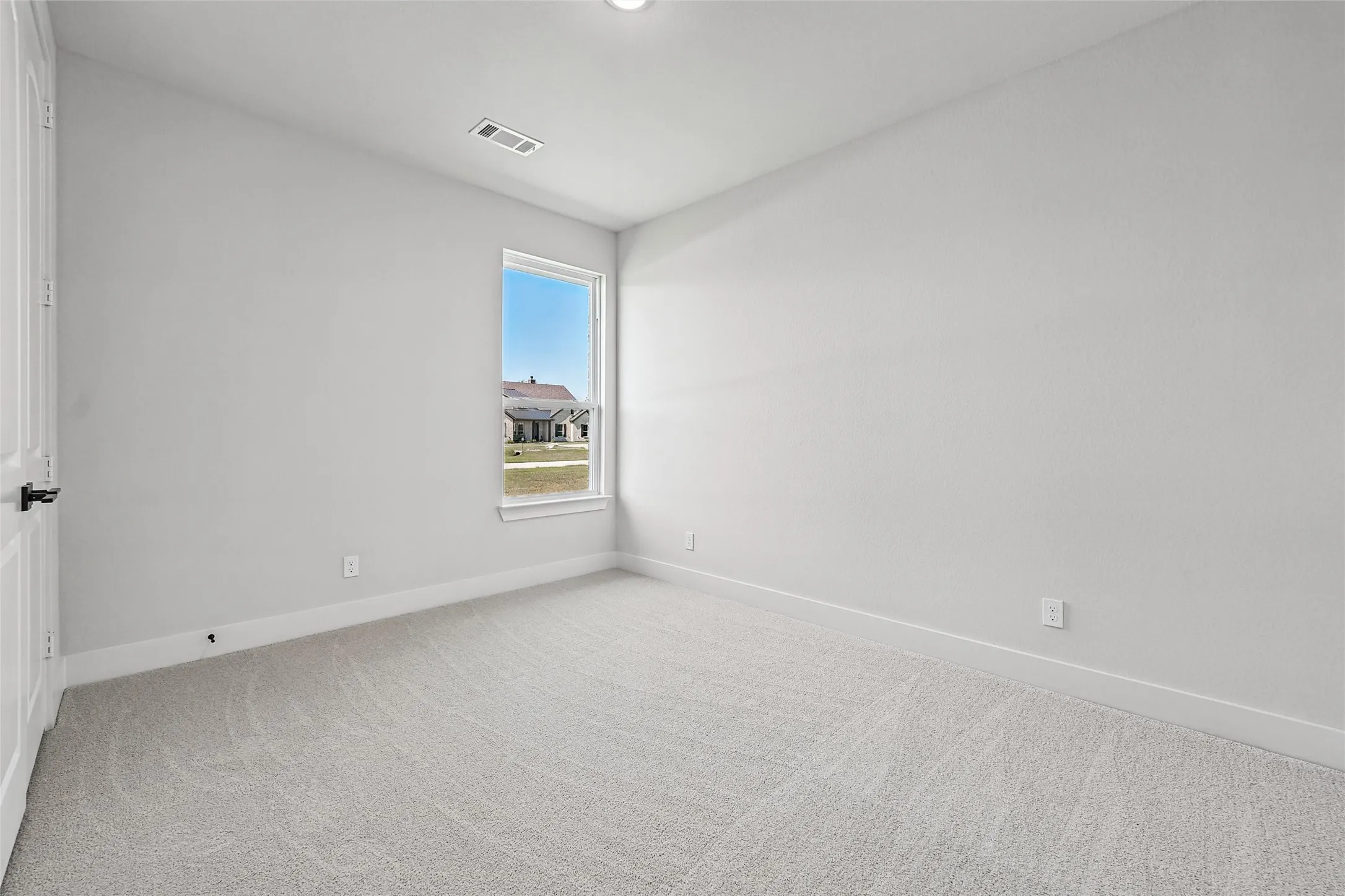 Recessed lighting, light-toned carpeting, and a window with white​​‌​​​​‌​​‌‌​‌‌​​​‌‌​‌​‌​‌​​​‌​​ trim