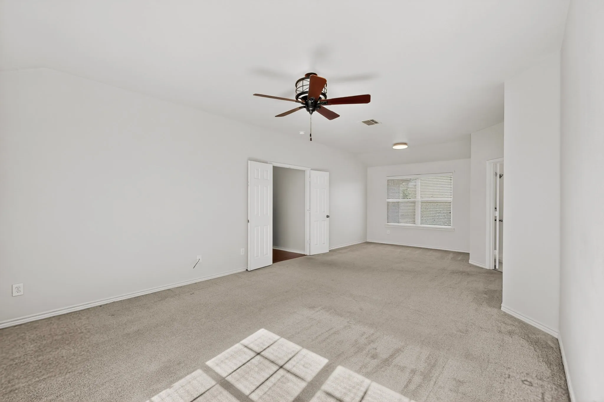 Large primary bedroom with sitting area.