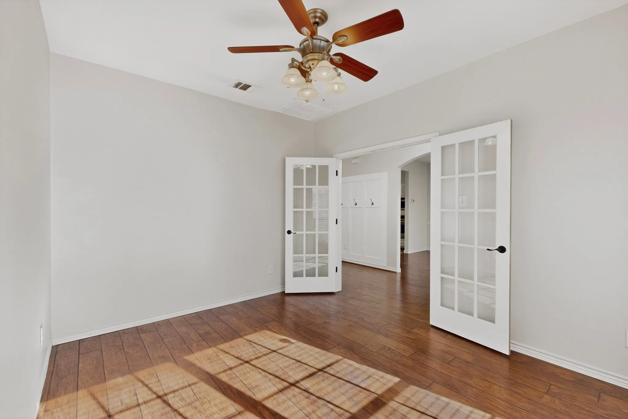 The downstair office area overlooks the front yard and includes French doors for privacy.