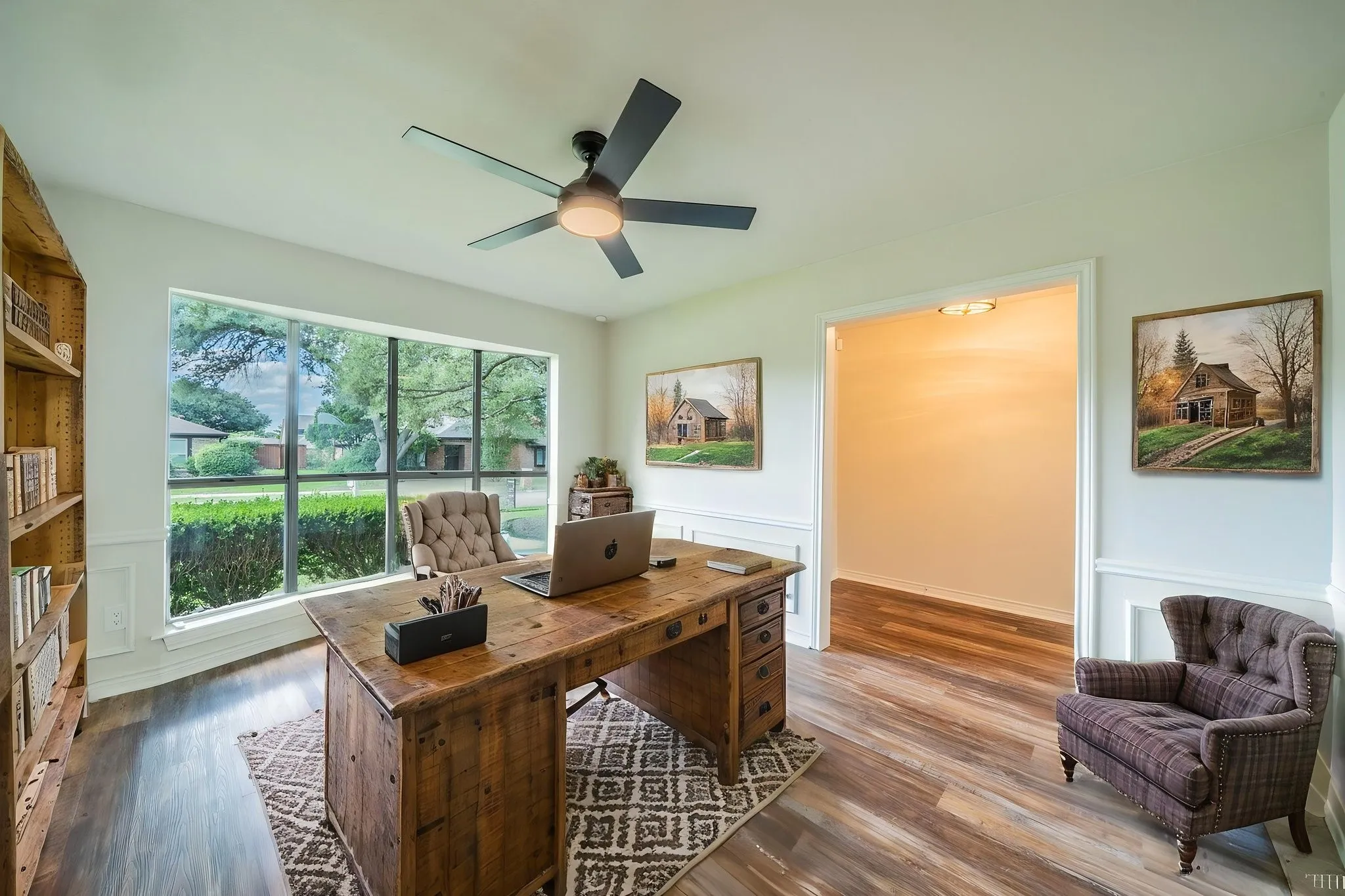 Virtually staged. Versatile room featuring wood-finish flooring and a large picture window