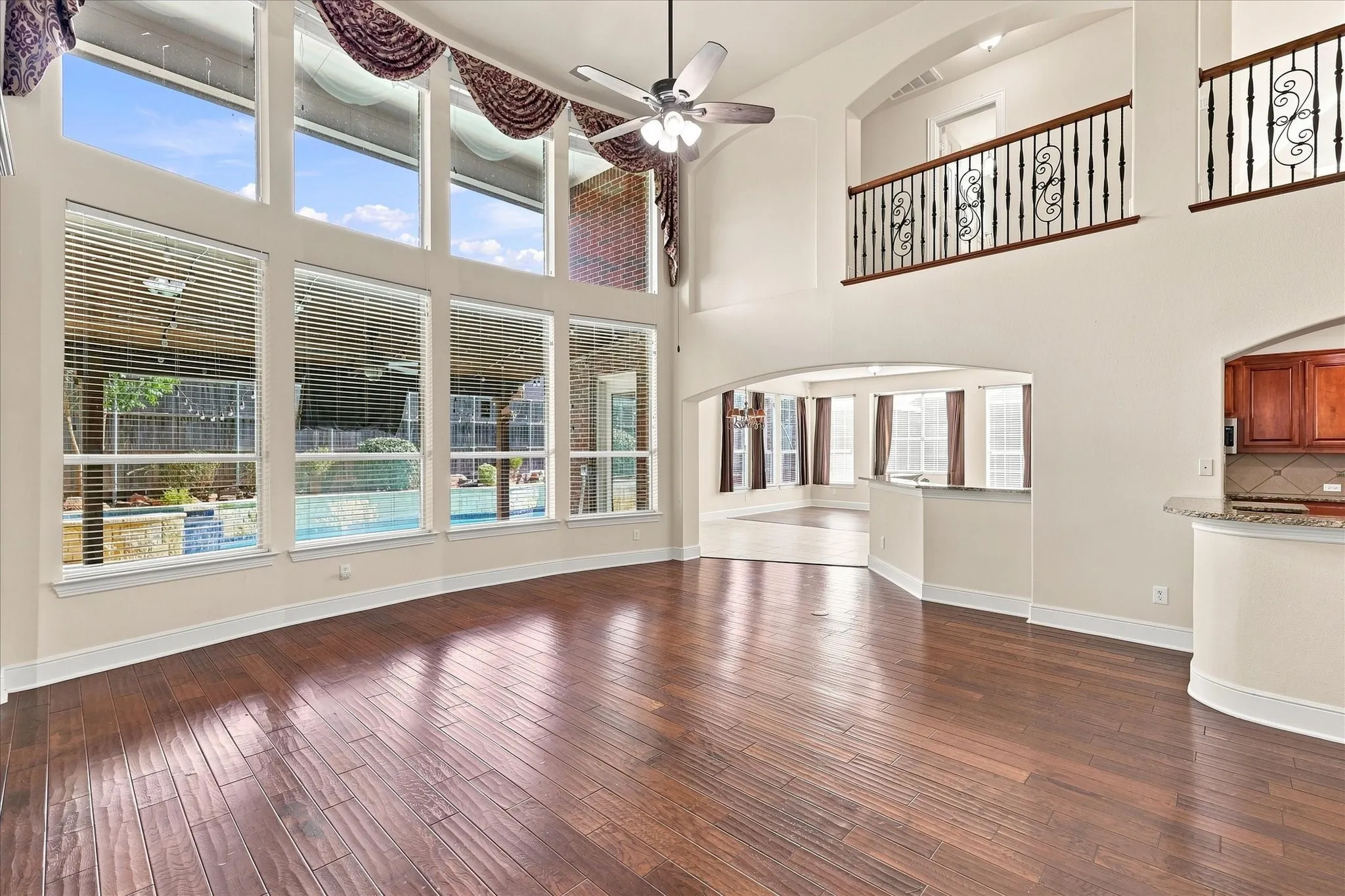 Two-story living area with wood-finish flooring
