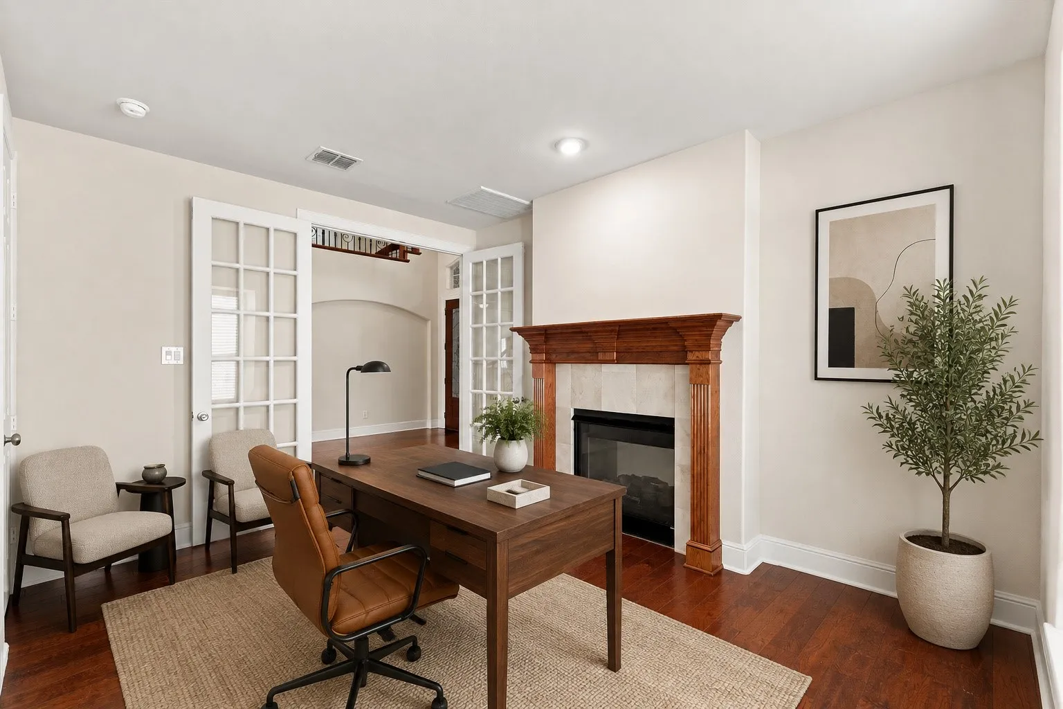 Virtually Staged Hardwood flooring throughout, featuring a fireplace with a wood mantel and tile surround