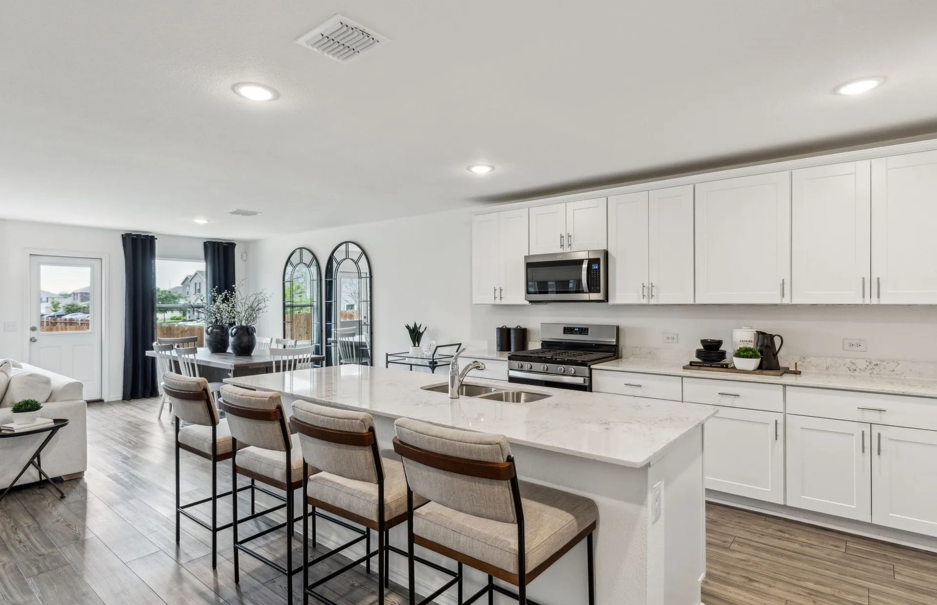 *Model Representation - Large island overlooking gathering room and dining areas