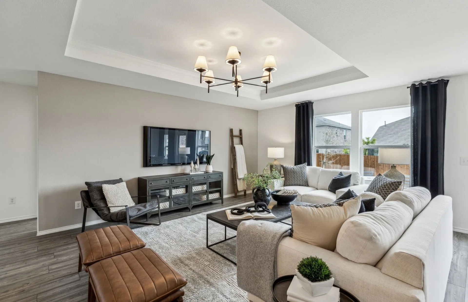 *Model Representation - Spacious gathering room with large windows